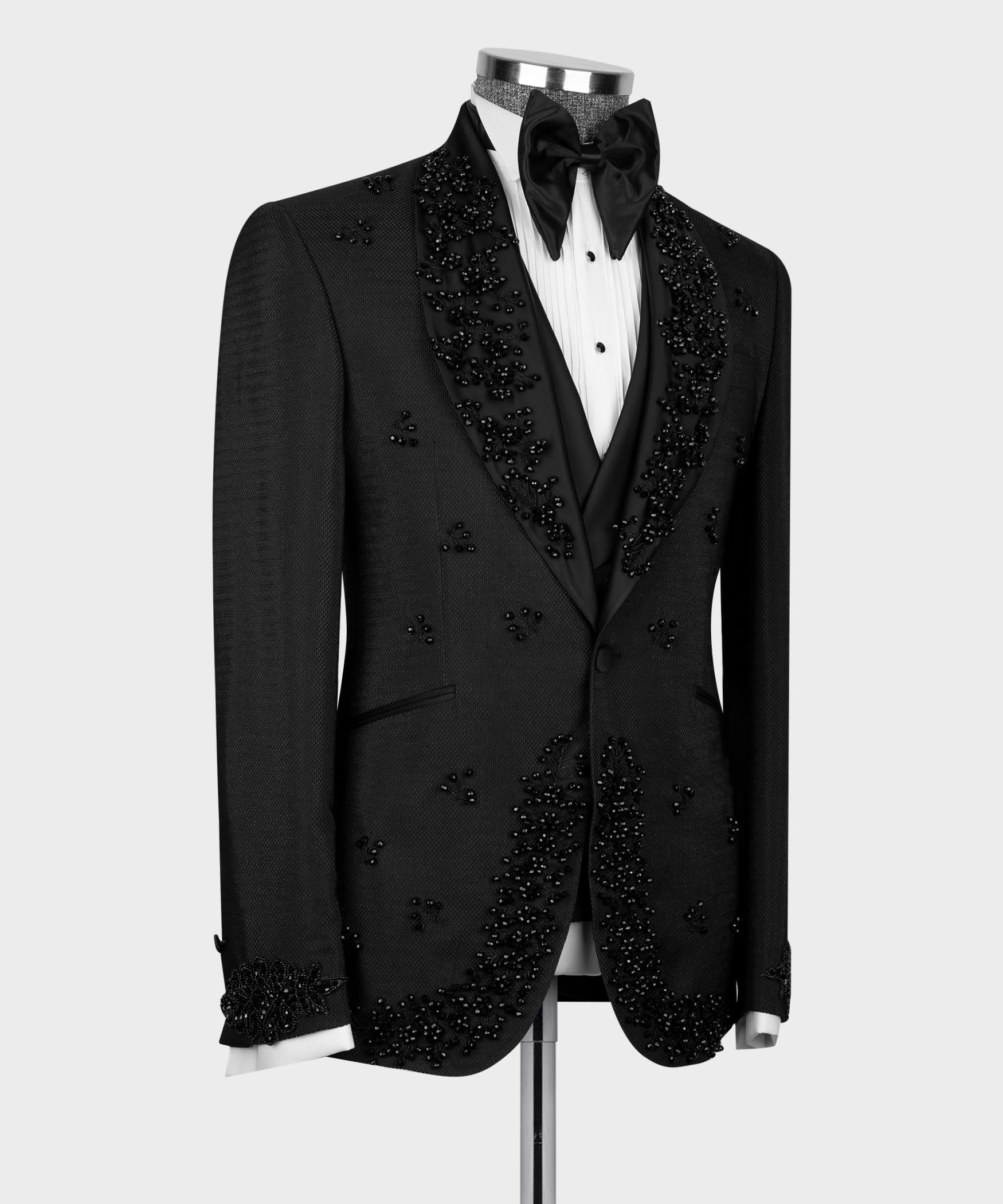 Black tuxedo jacket set with jeweled lapels, three-button vest, bow tie