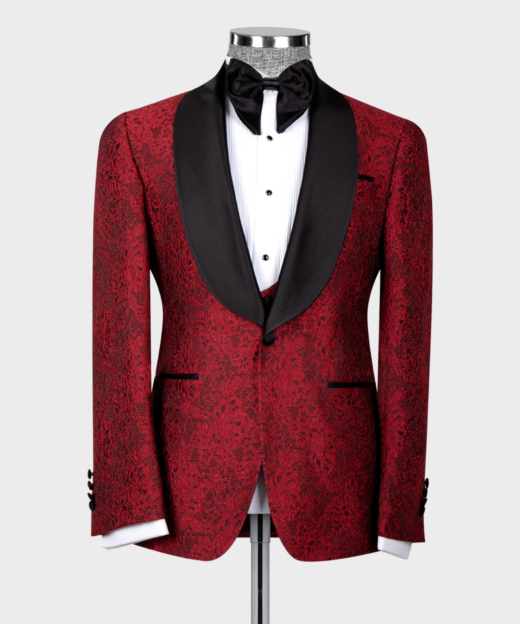 Red tuxedo set front view: black satin collar, bow tie, and buttoned waistcoat