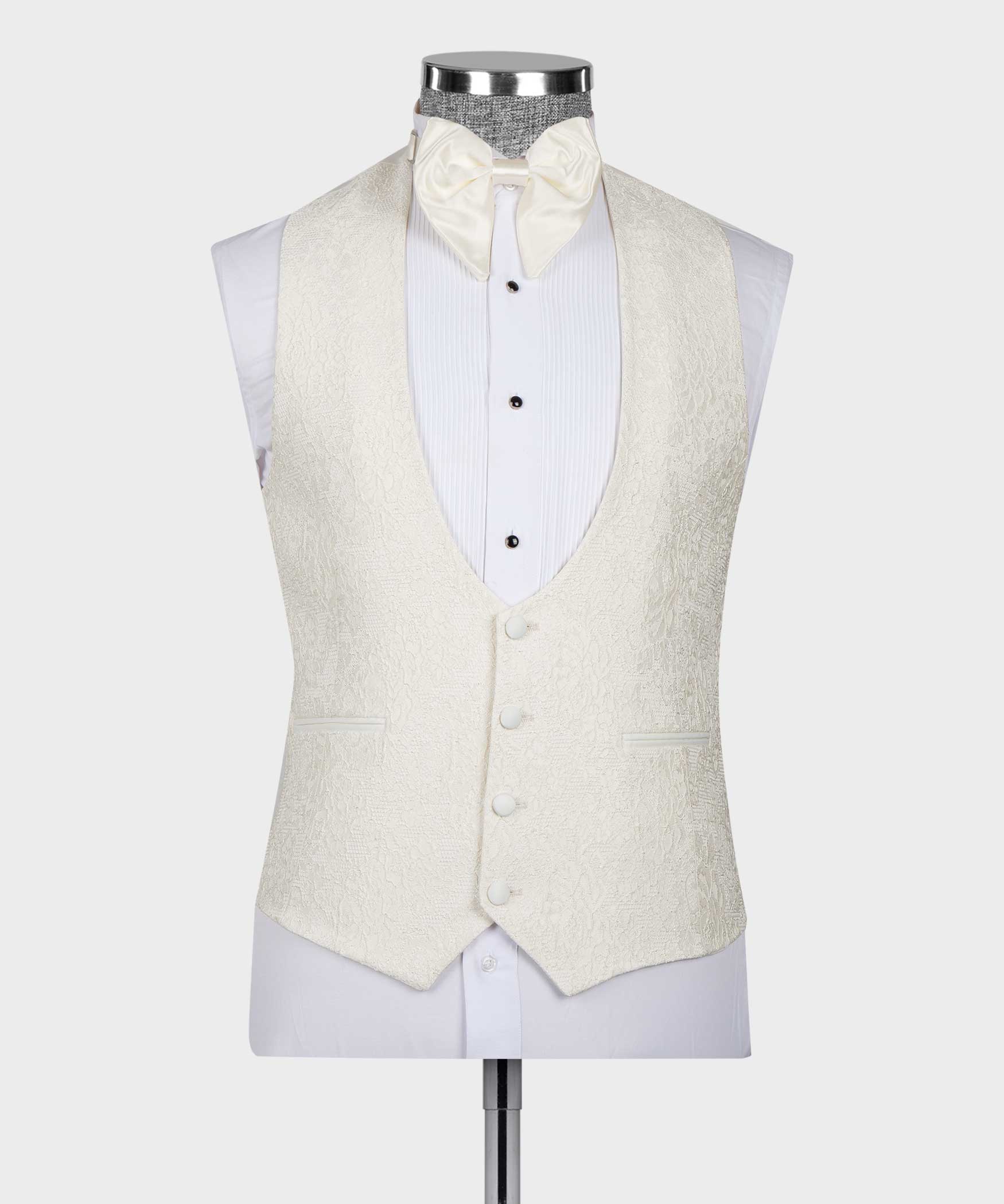 Cream tuxedo vest with four-button front, bow tie and white striped shirt