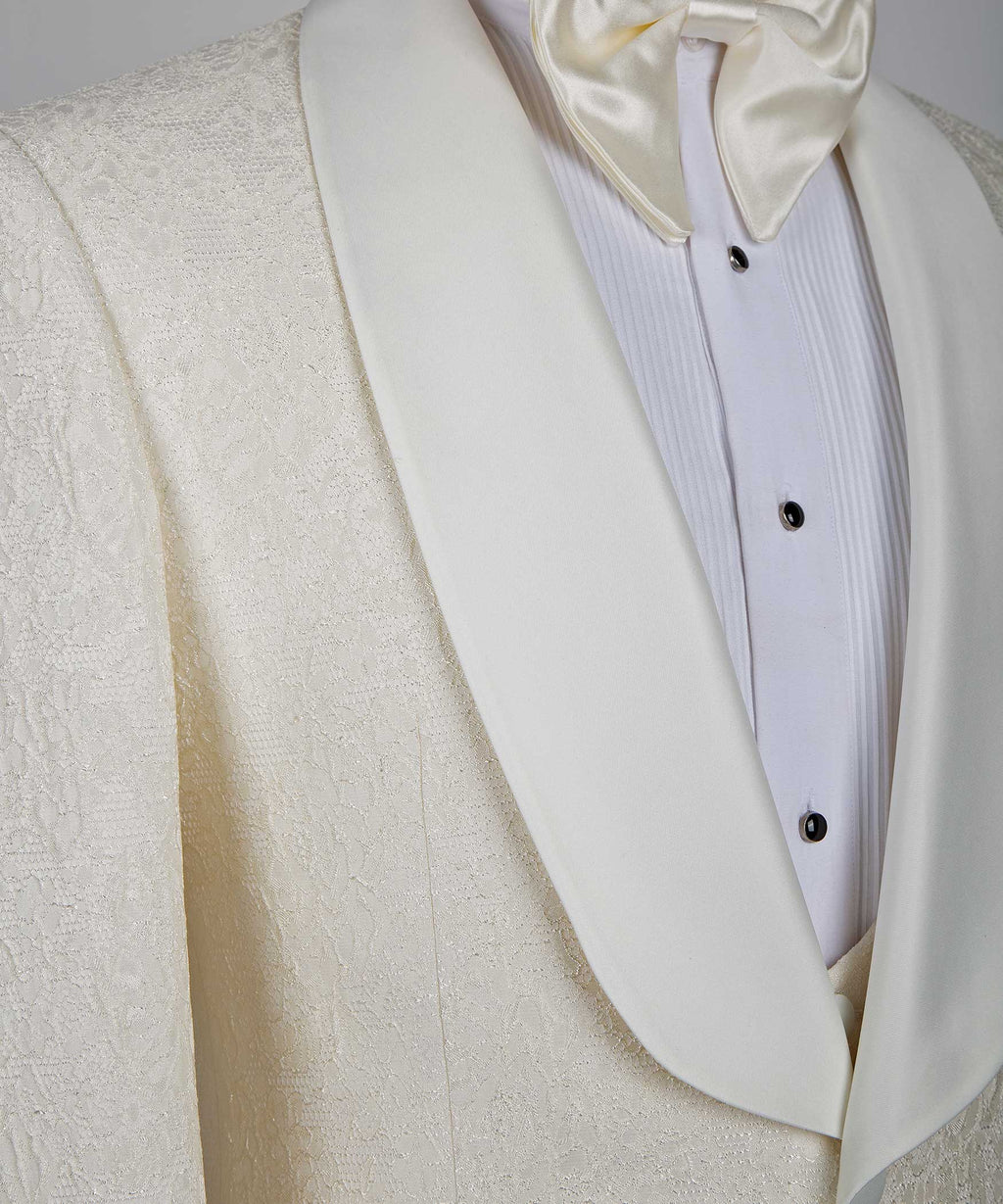 Cream satin lapel and chest placket, black buttons on white dress shirt