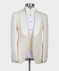 Cream tuxedo jacket with satin-lapel bow tie, white shirt front on mannequin
