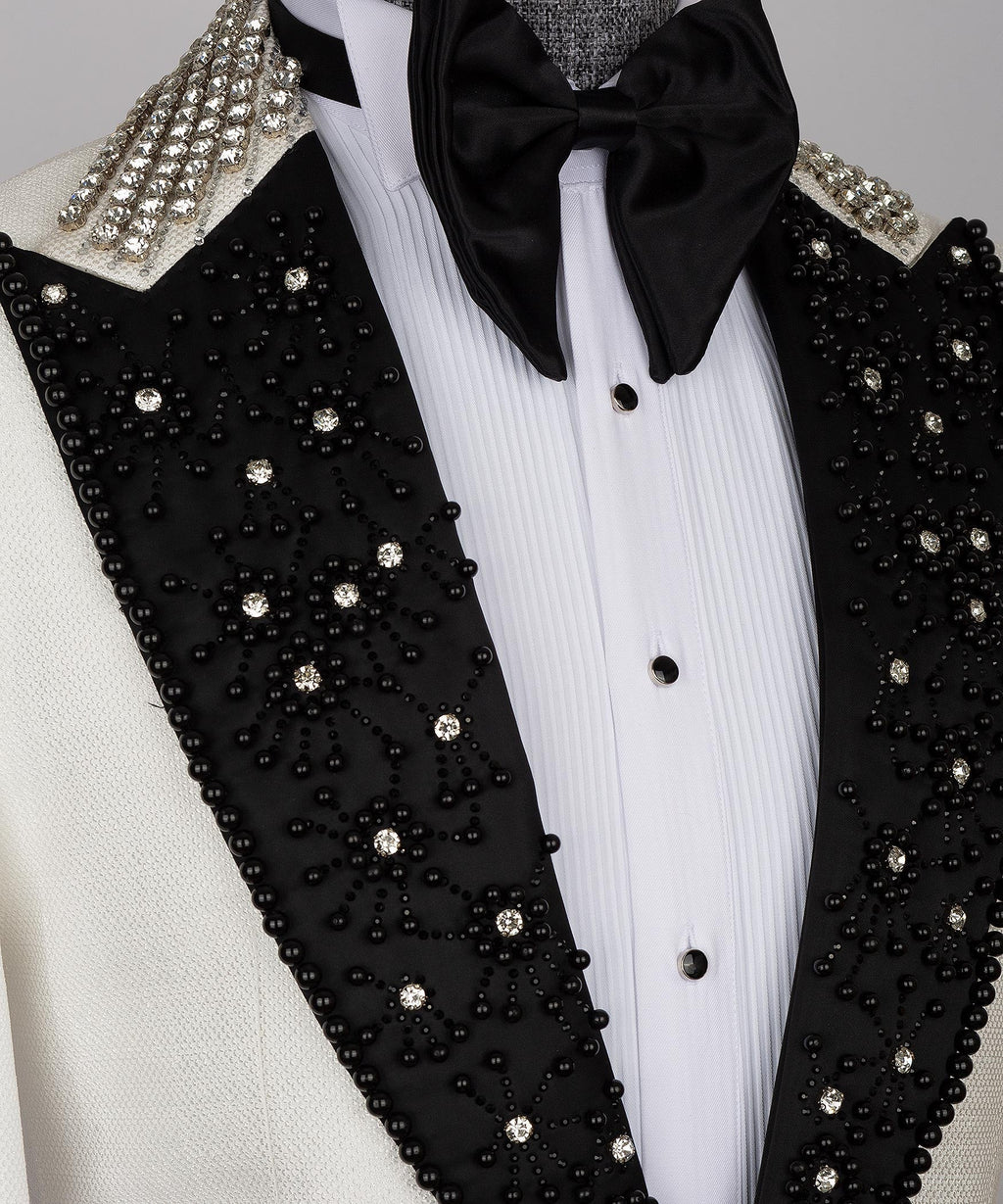 Black jeweled lapels with rhinestone clusters and gold-toned beaded trim
