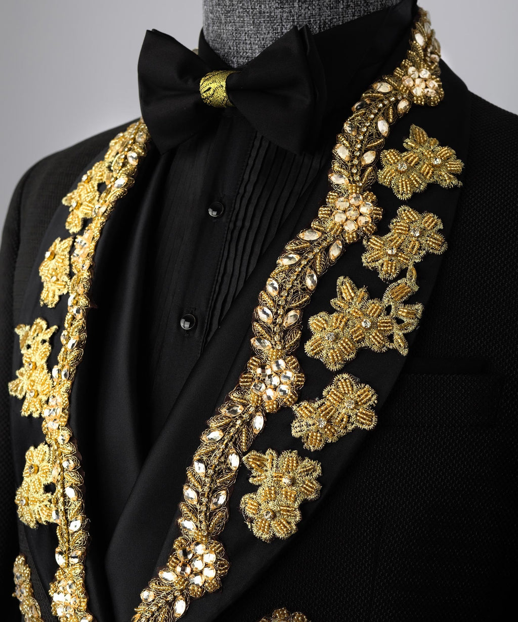 Black tuxedo neckline with gold floral embroidery and black bow accent