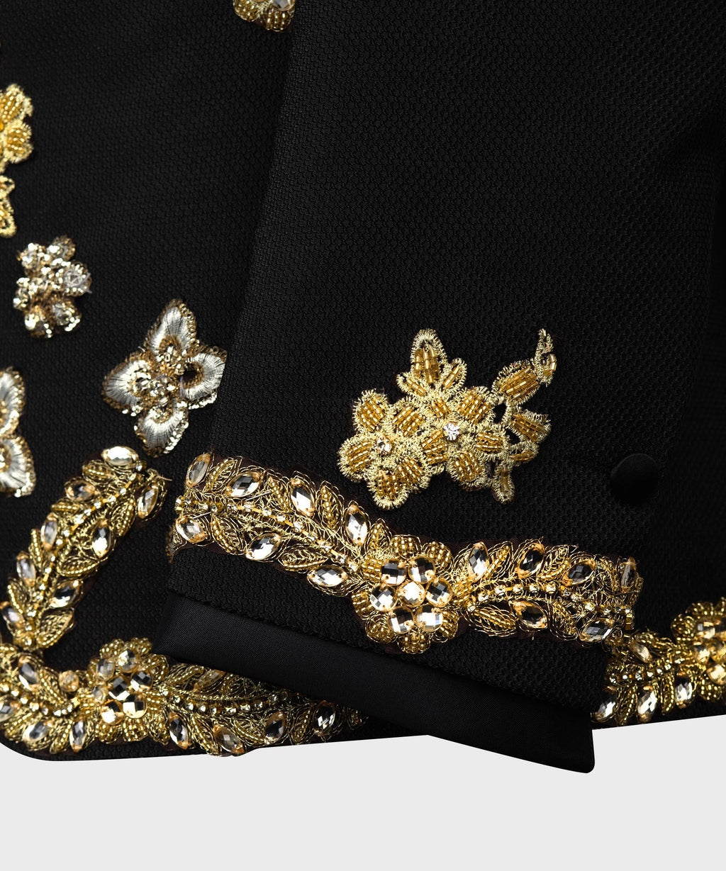 Black jacket cuff with gold beaded floral embroidery and decorative band