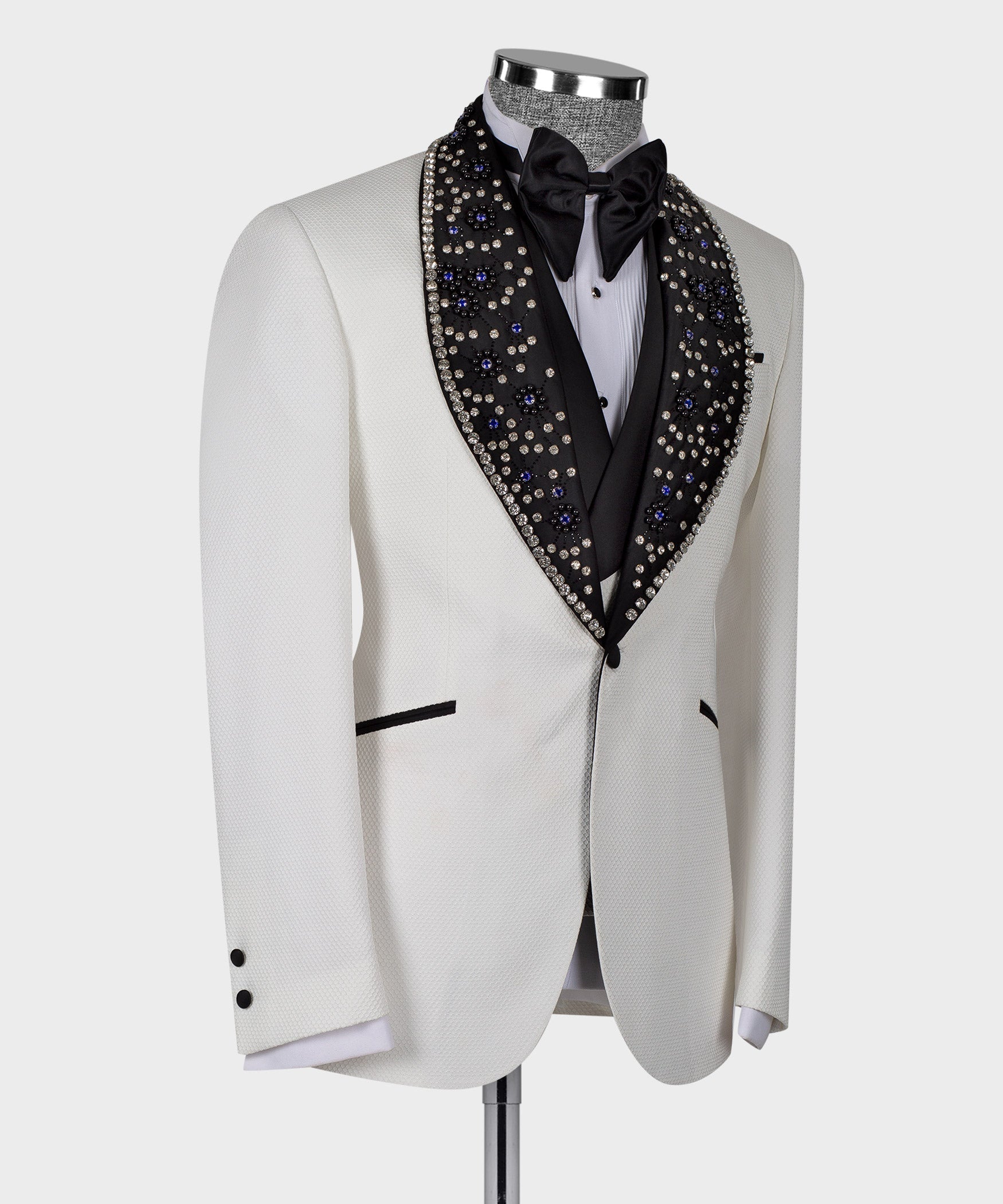 White tuxedo jacket front view with black bow tie and crystal jeweled lapel trim