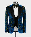 Blue velvet tuxedo jacket with black lapels, gold studs, and matching waistcoat