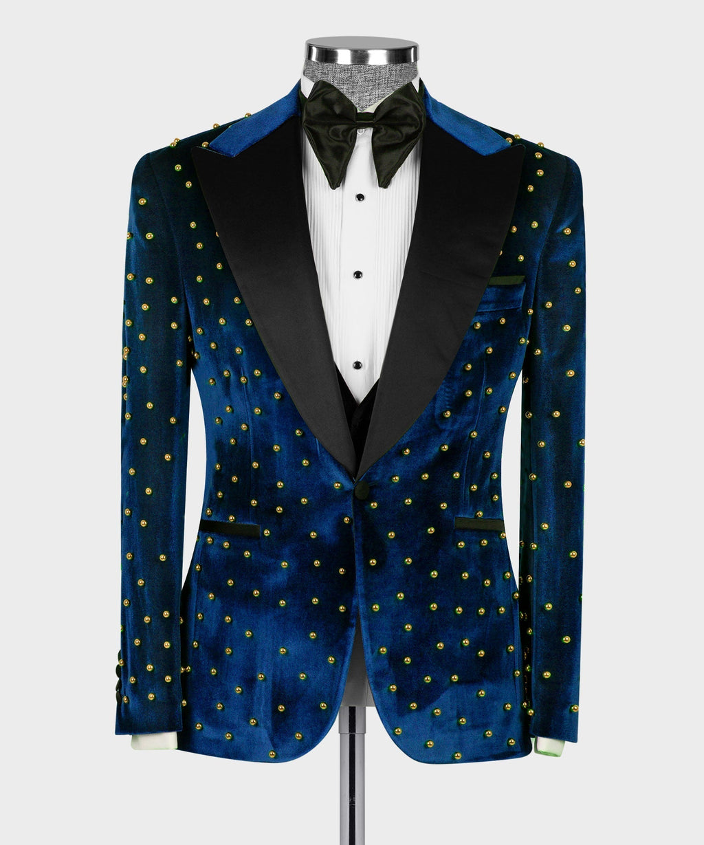 Blue velvet tuxedo jacket with gold studs and black panels, with waistcoat