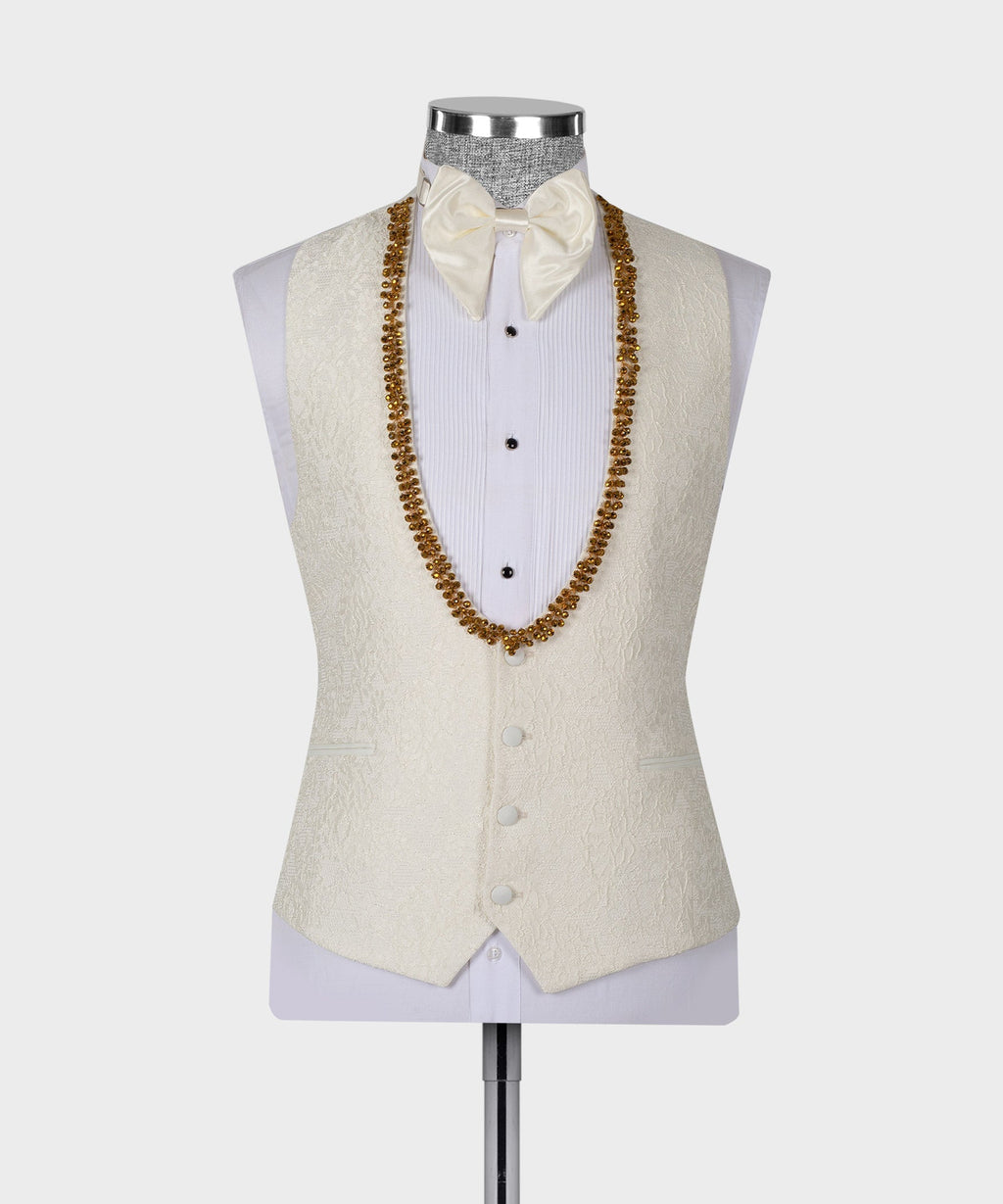 Cream tuxedo vest set with gold beaded V trim and white bow tie and shirt