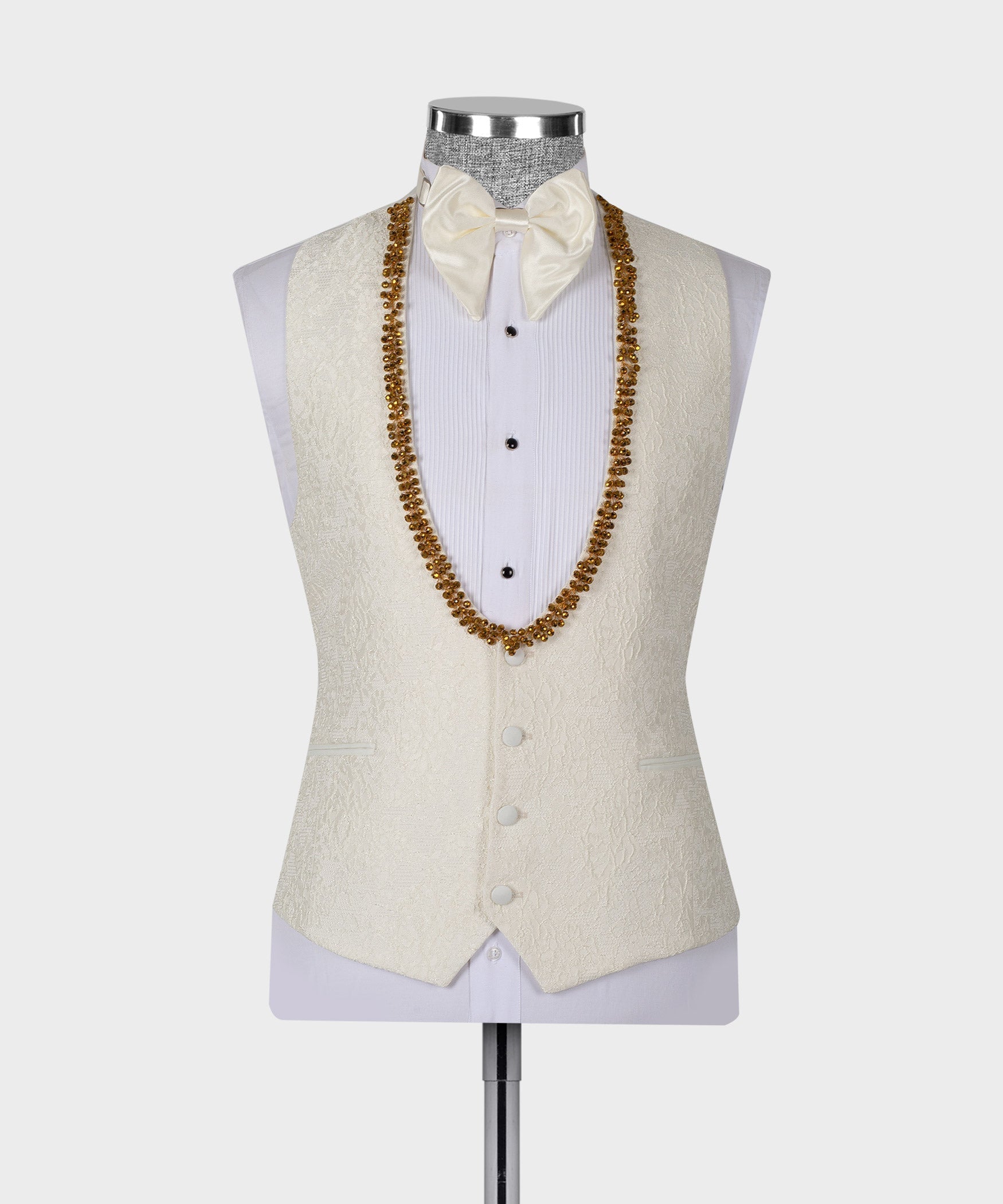 Cream tuxedo vest set with gold beaded V trim and white bow tie and shirt