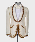 Cream tuxedo jacket with long gold bead garland trim and bow tie over white shirt