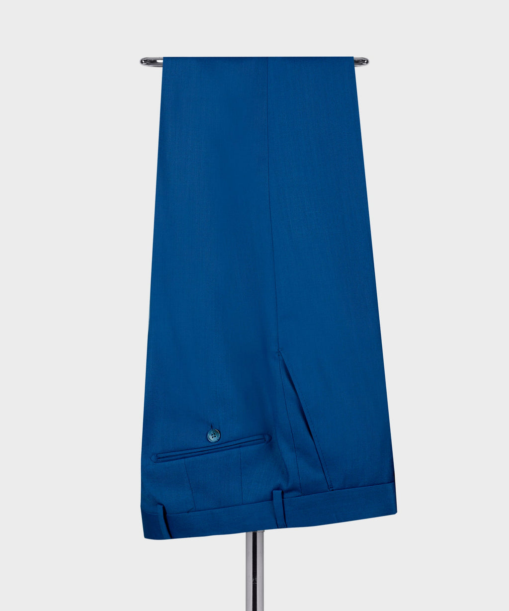 Blue suit trousers with belt loops, front crease, and cuffed hem details