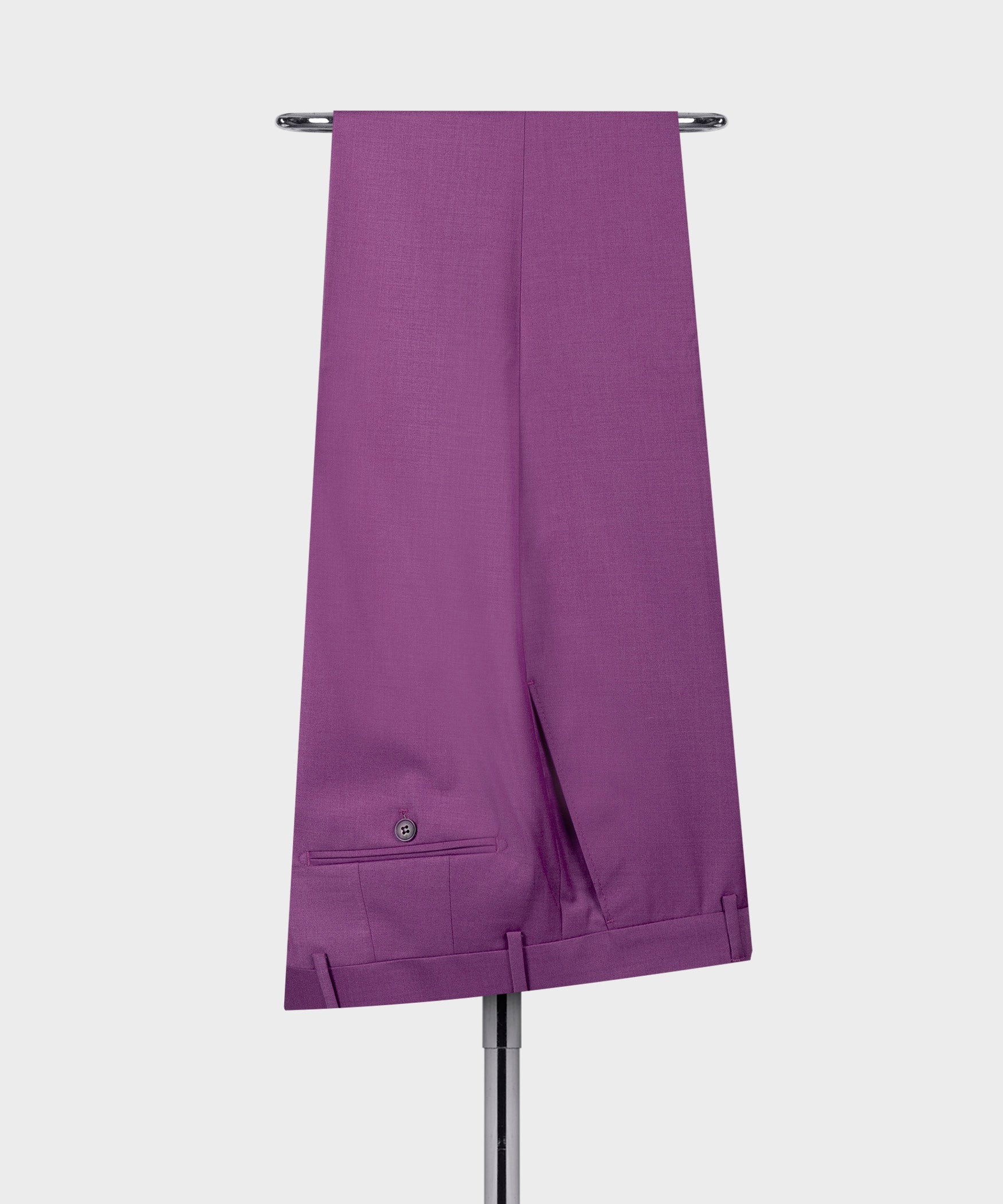 Purple dress trousers with center crease and waistband button detail; side pockets visible