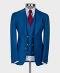 Blue business suit jacket with gold buttons, red patterned tie, and matching pocket square