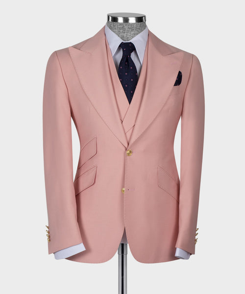 Powder pink suit jacket with pocket flaps and gold buttons, styled with vest