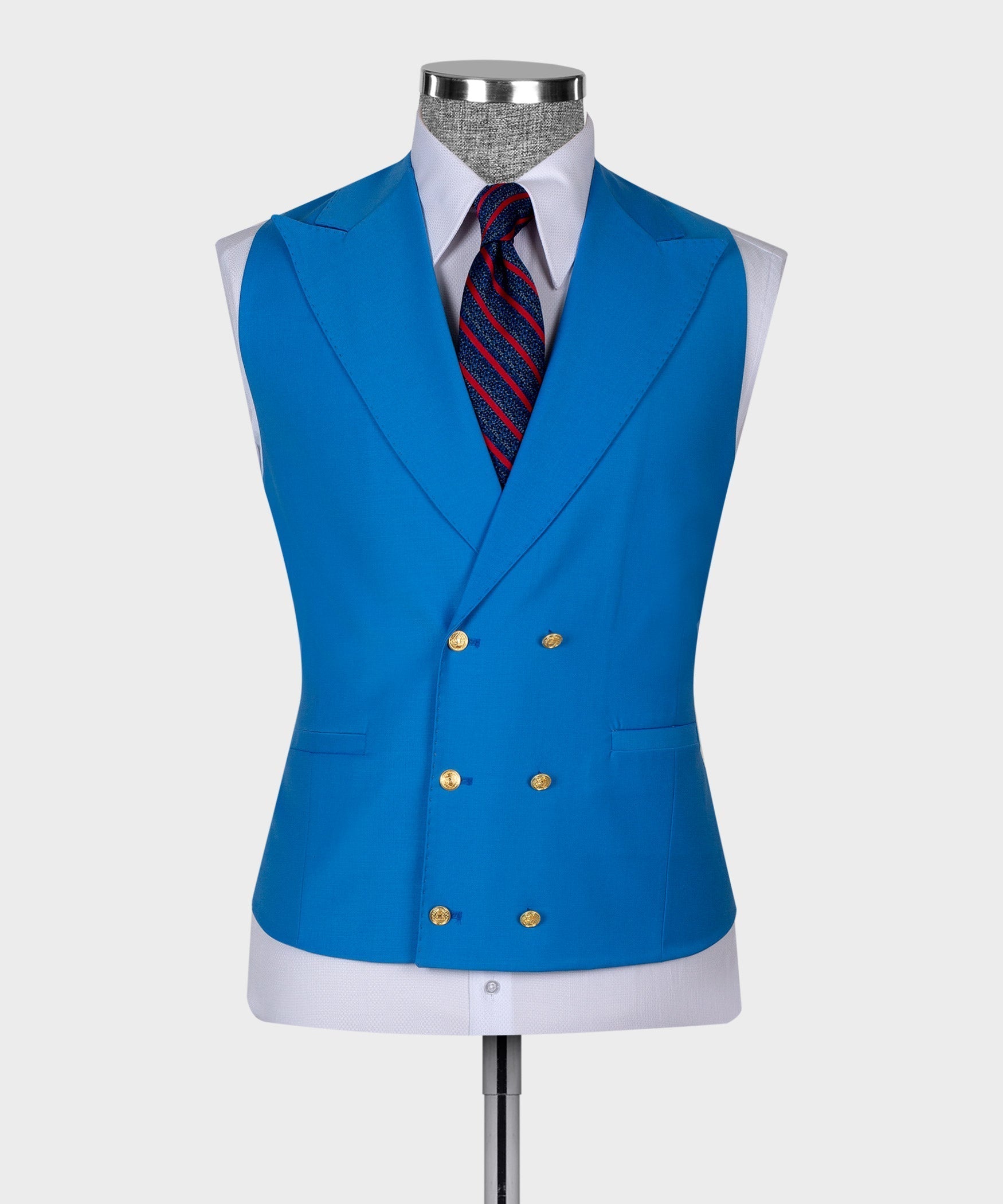 Light blue waistcoat with gold buttons over white shirt and striped necktie