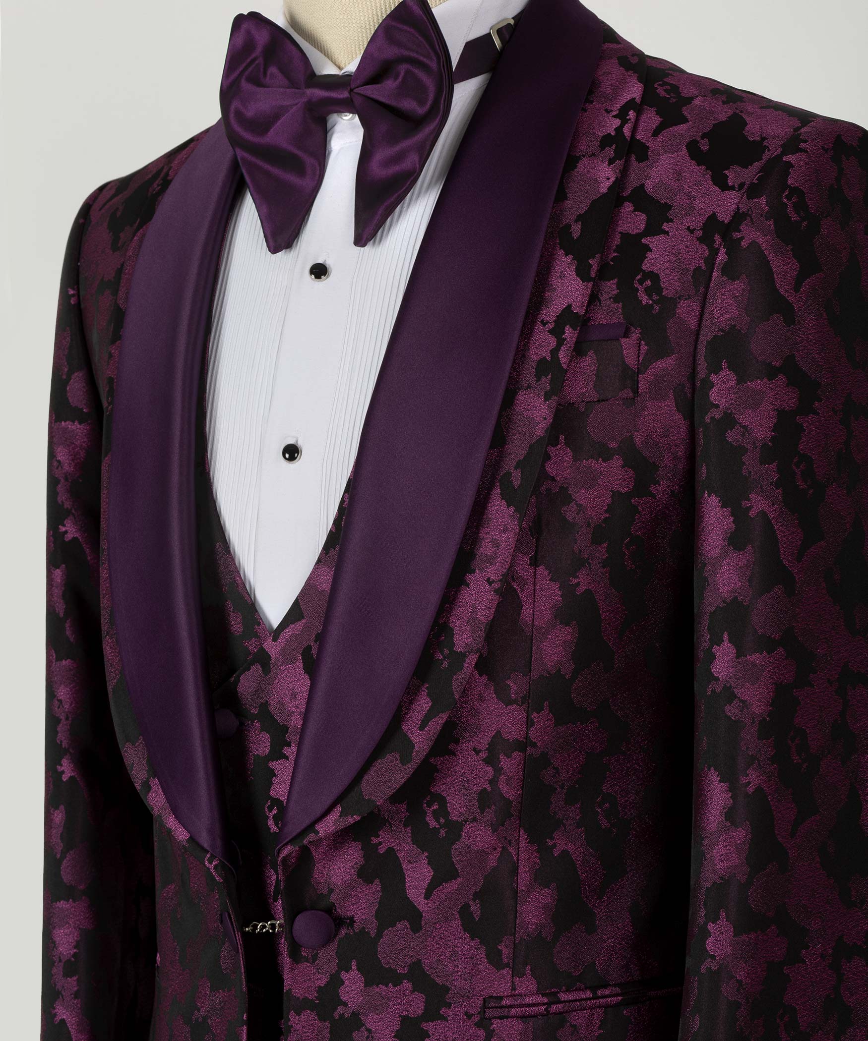 Neckline detail: burgundy-purple patterned tux jacket, satin bow tie, purple lapels and buttons