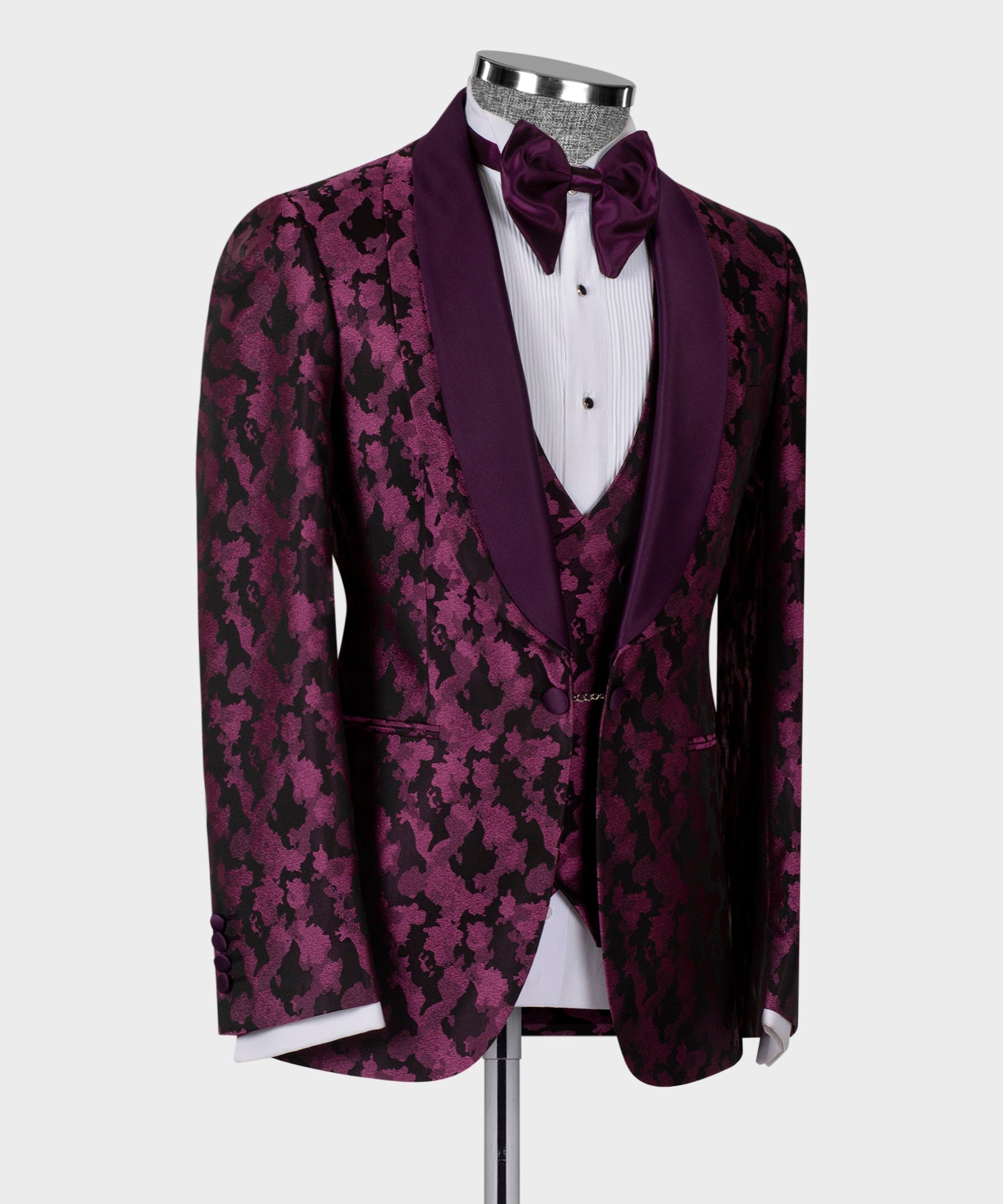 Purple patterned tuxedo jacket with double lapels and bow tie, white shirtfront and waistcoat