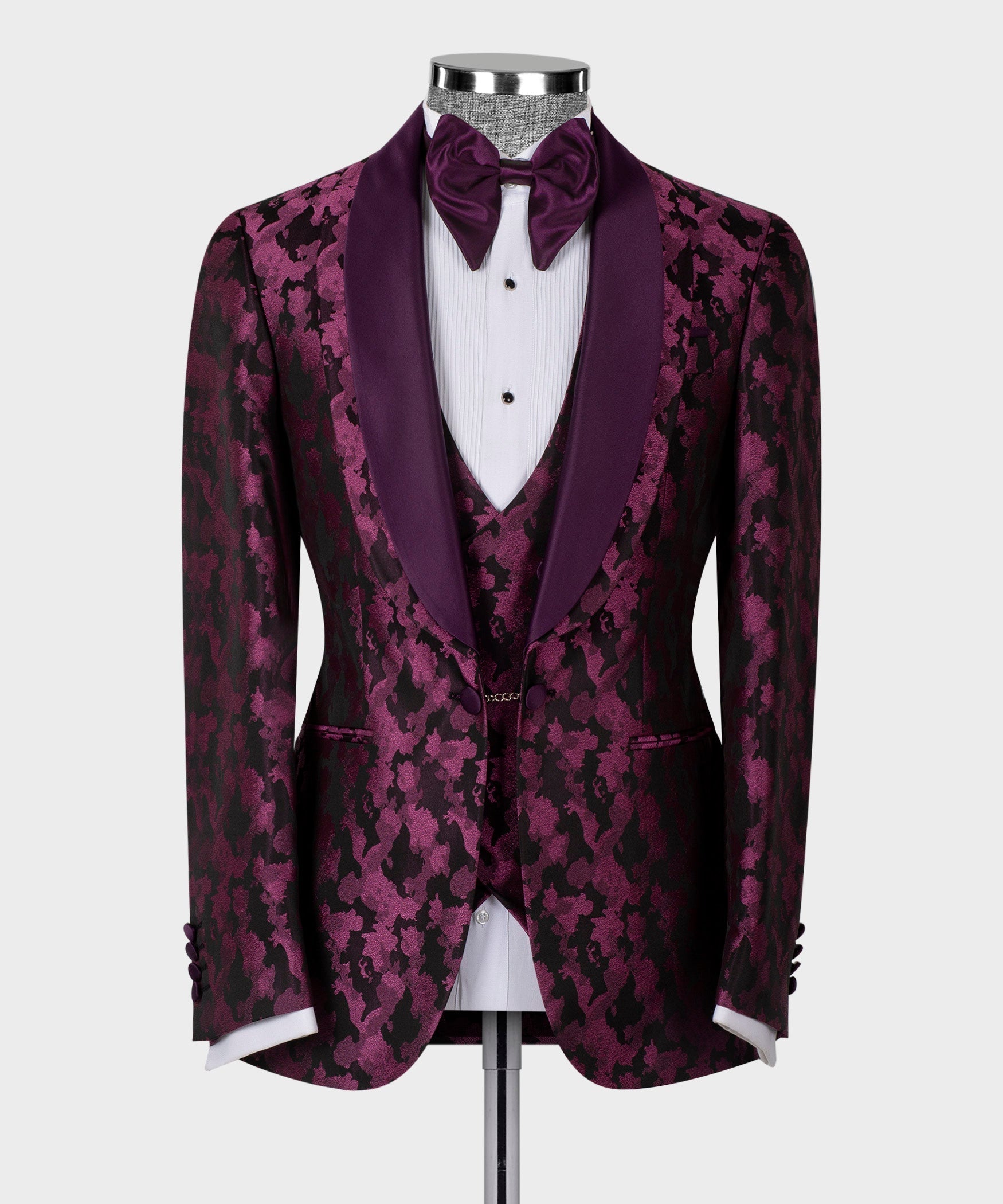 Purple tuxedo jacket front view with double satin lapels, patterned texture, bow tie