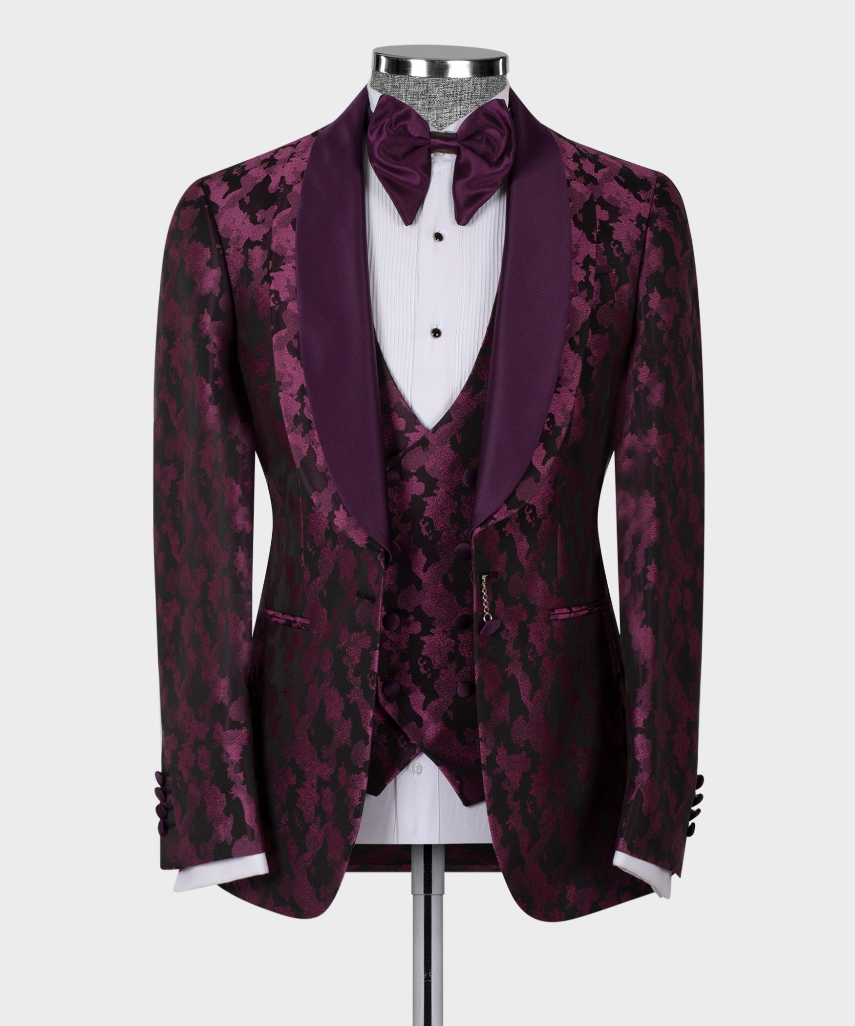 Purple double-lapel tuxedo jacket with patterned fabric, satin trim, bow tie and waistcoat