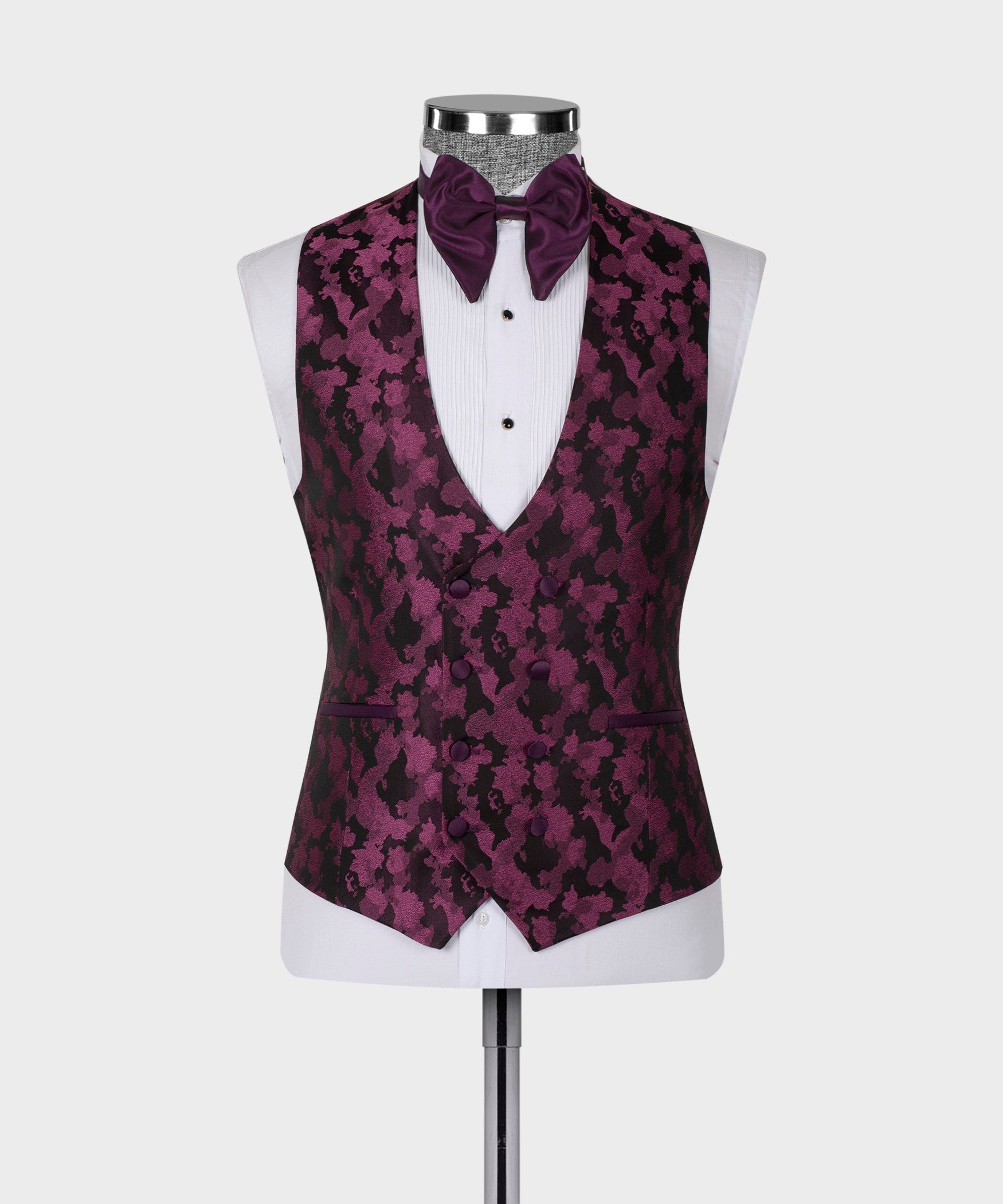 Purple patterned waistcoat with bow tie and white shirt front, displayed on mannequin