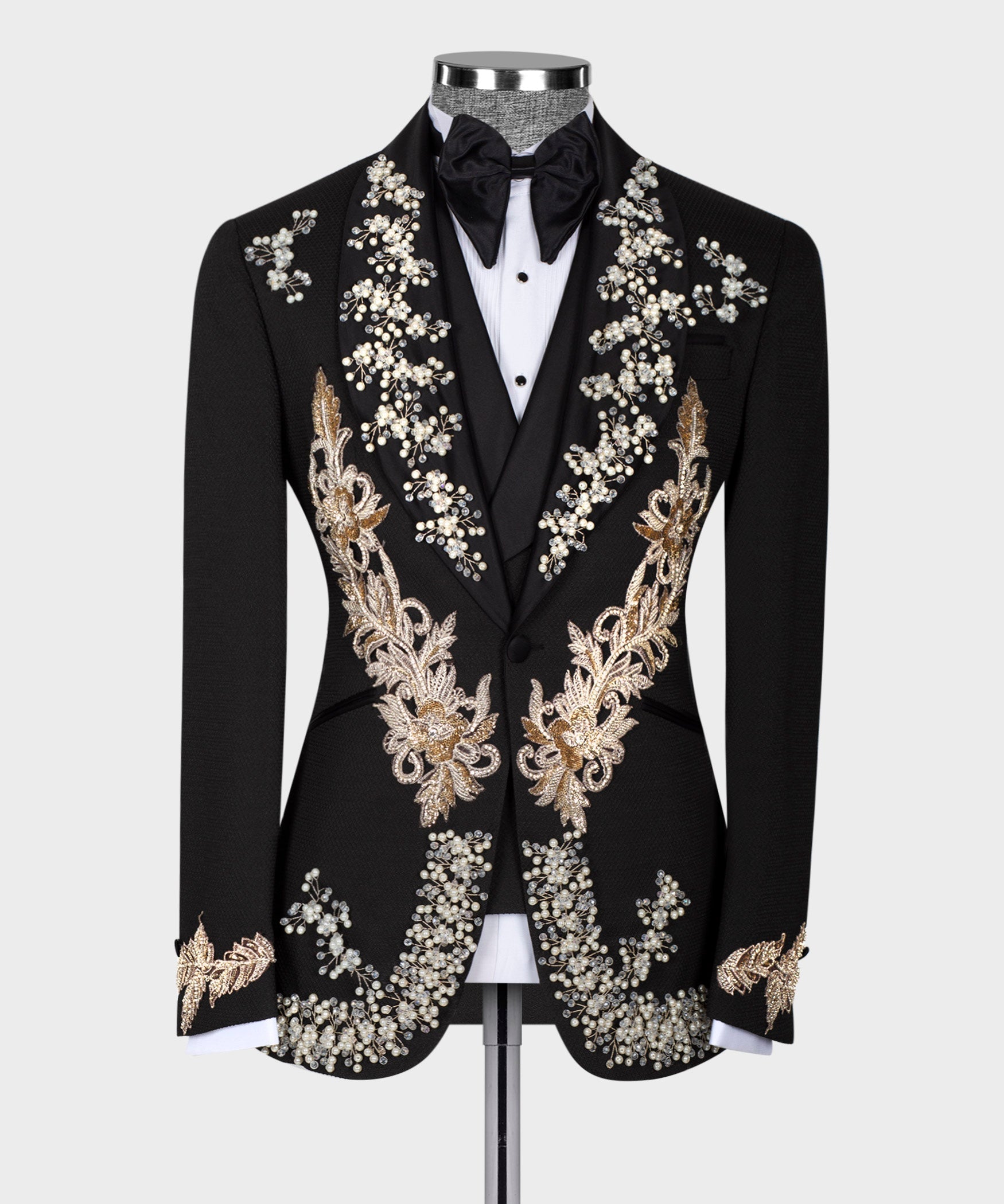 Black tuxedo jacket with ornate pearl and gold embroidery, floral vines across front