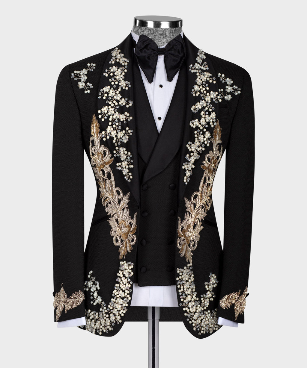 Black crystal tuxedo jacket with bow tie, pearl-and-gold floral embellishment on lapels