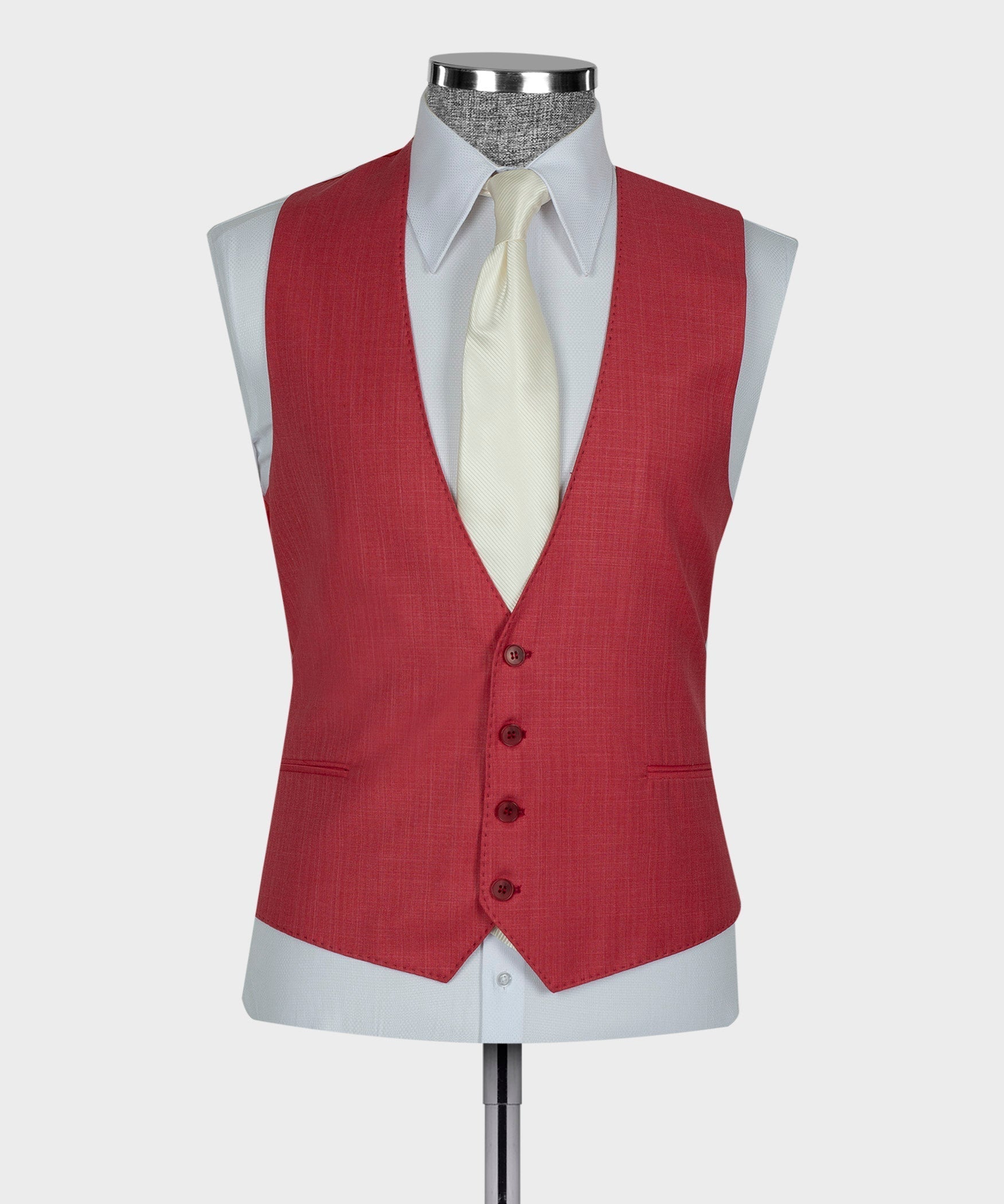 Red waistcoat with button placket, worn with white shirt and cream tie