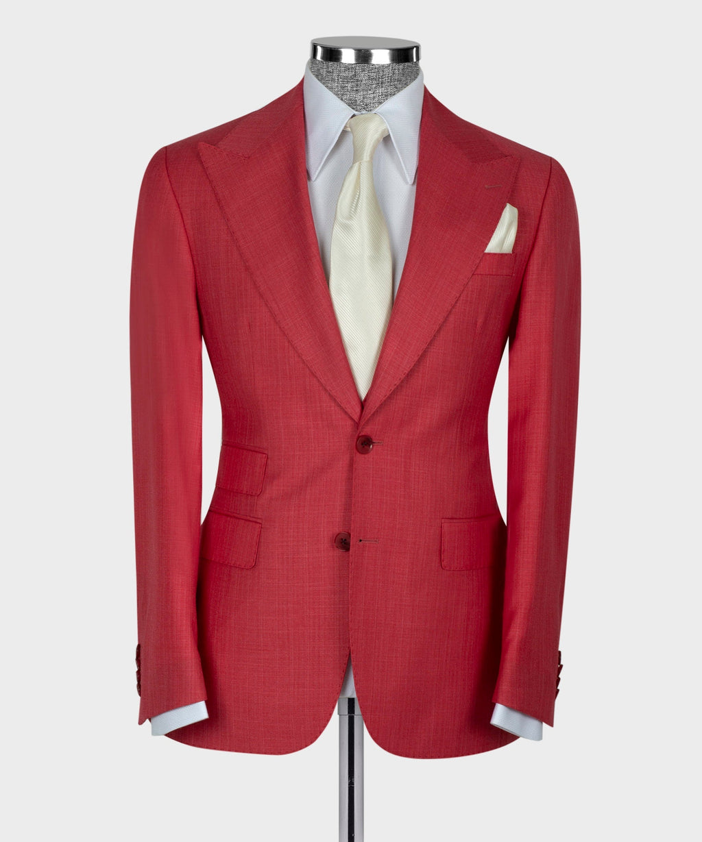 Red suit jacket front with notch lapels and chest pocket; white shirt and vest
