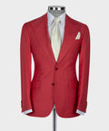 Red suit jacket front with notch lapels and chest pocket; white shirt and vest