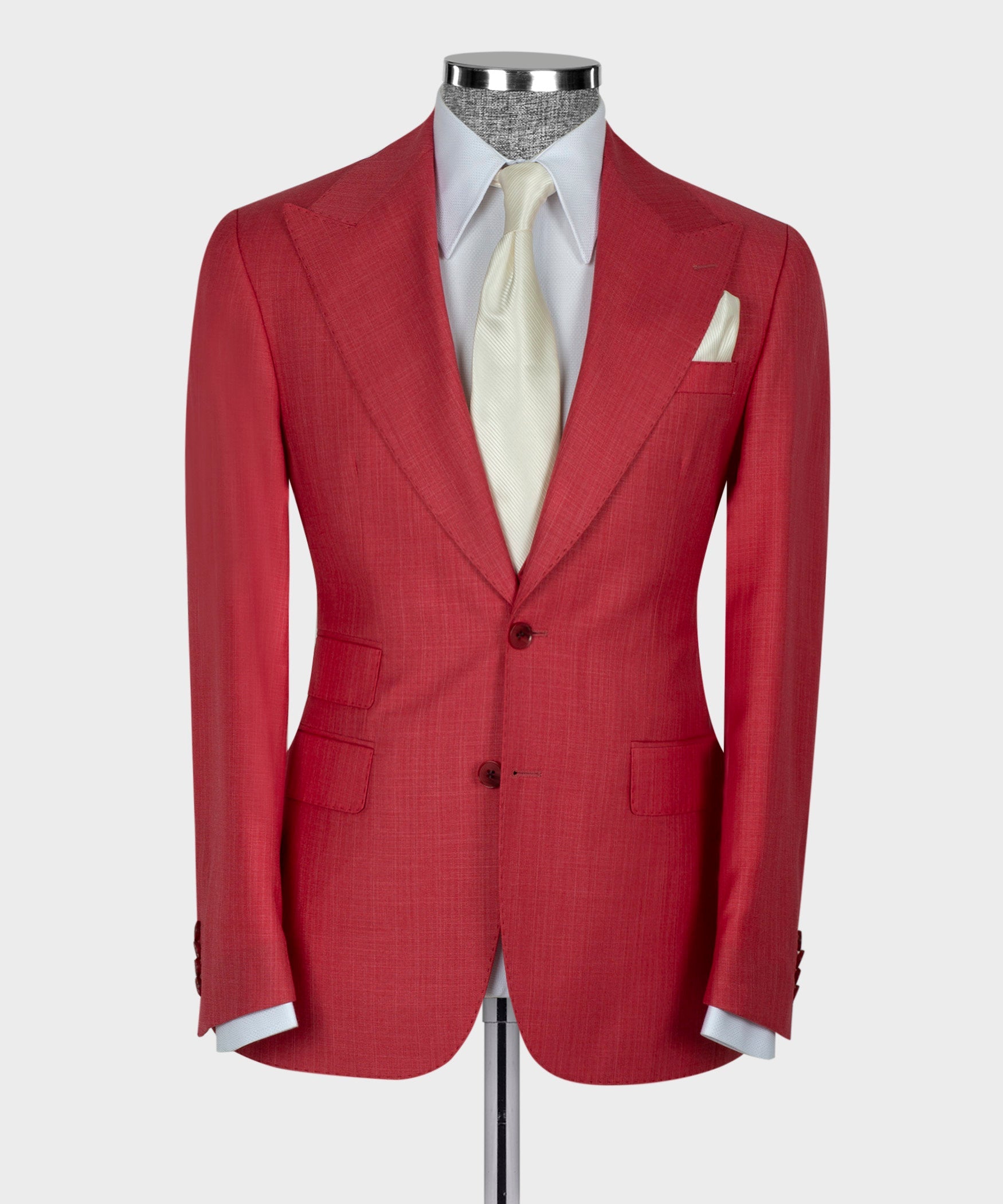 Red suit jacket front with notch lapels and chest pocket; white shirt and vest