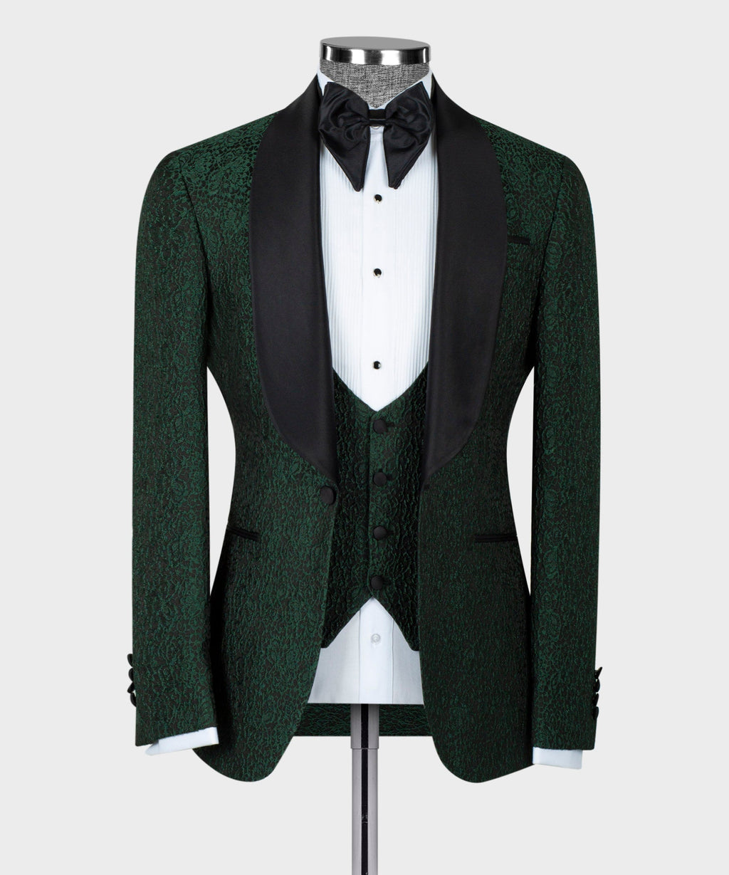 Green tuxedo jacket with black satin lapels, bow tie, and patterned waistcoat