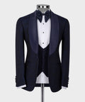 Blue satin-collar tuxedo suit on mannequin: bow tie, vest, satin-trim lapels.
