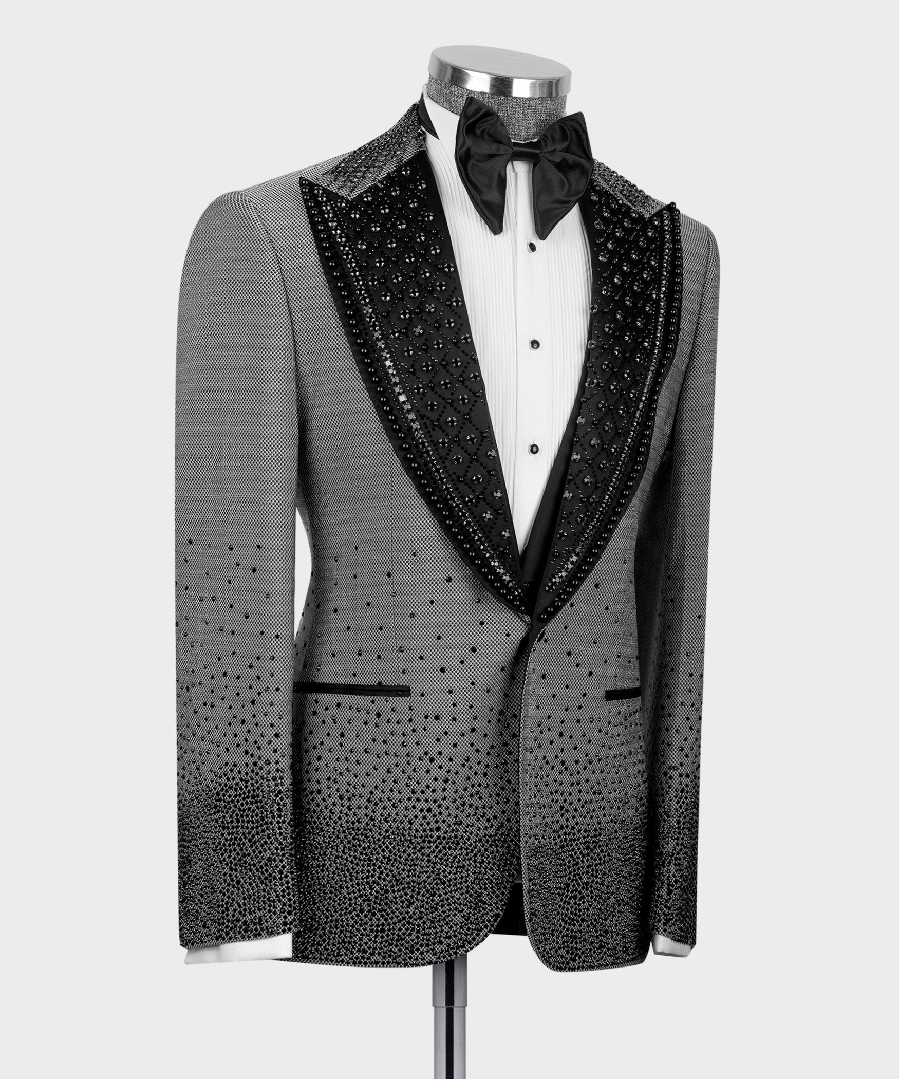 Gray tuxedo close front: black embellished shawl lapels, white shirt, bow tie