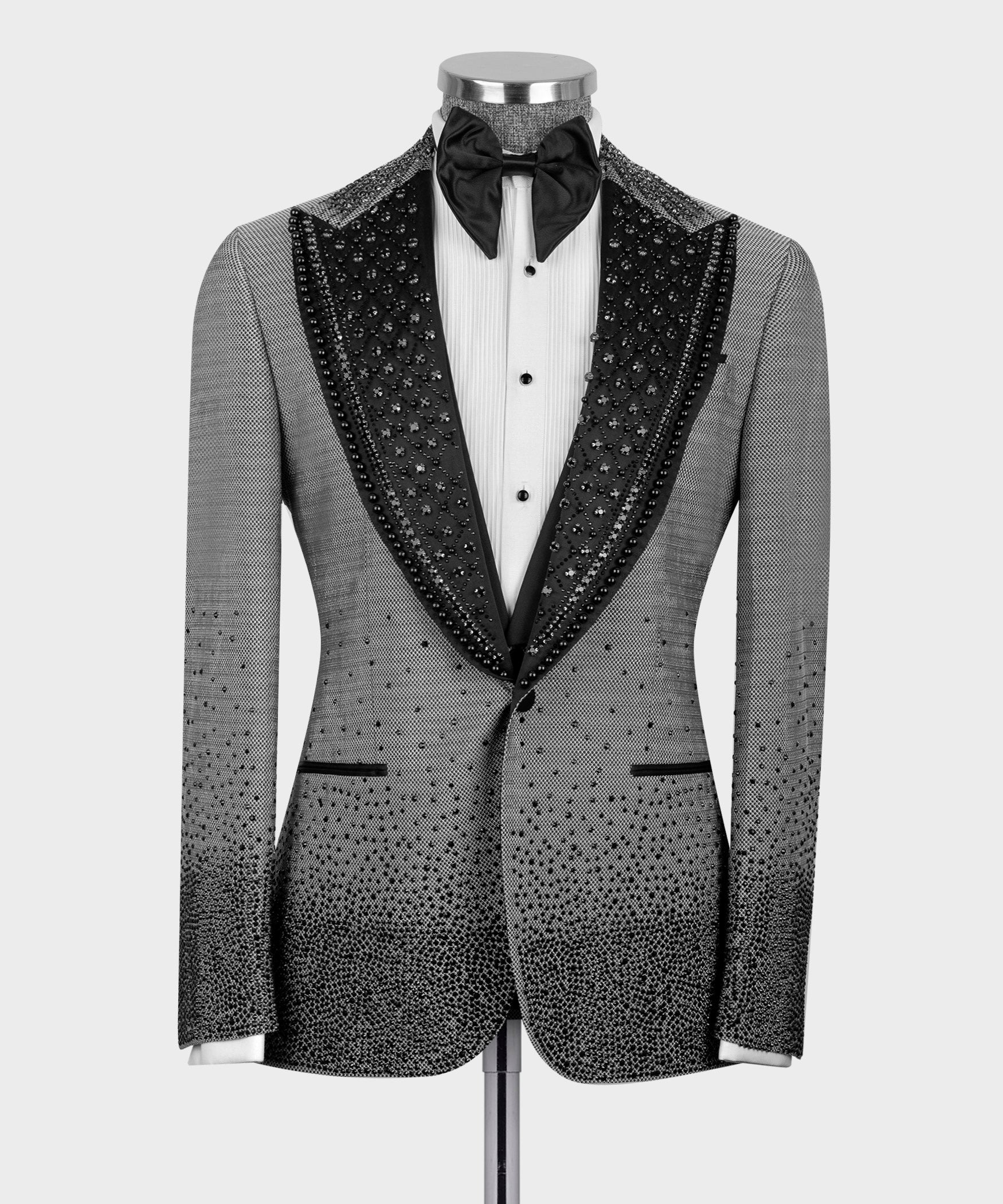 Gray tuxedo front view: sparkling black-trim lapels, white shirt, black bow tie