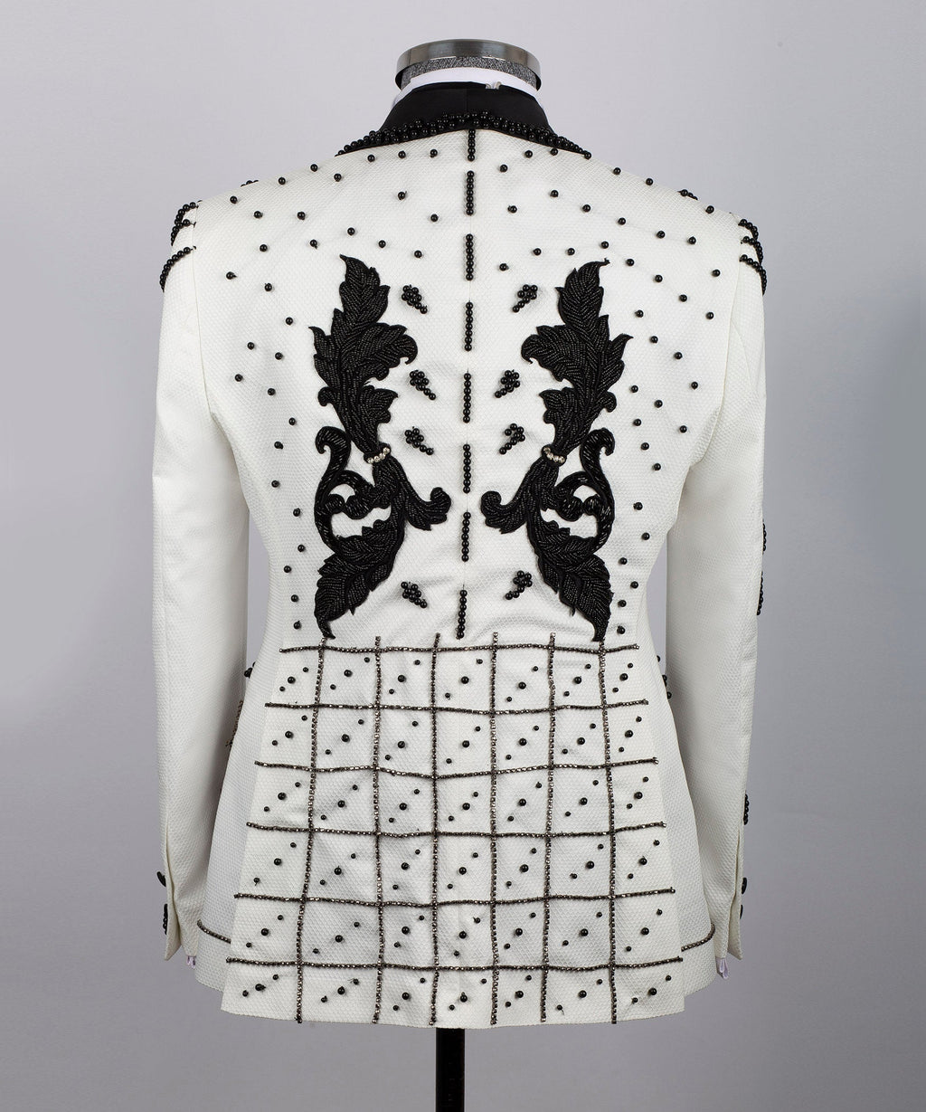 Back view white silk tuxedo jacket with symmetrical black floral crystal details