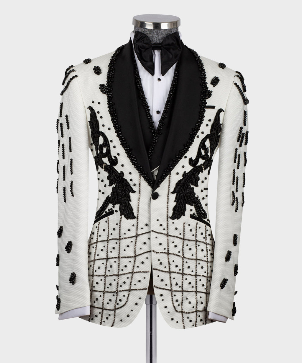 Front view white tuxedo jacket with black bow tie and beaded floral appliqués