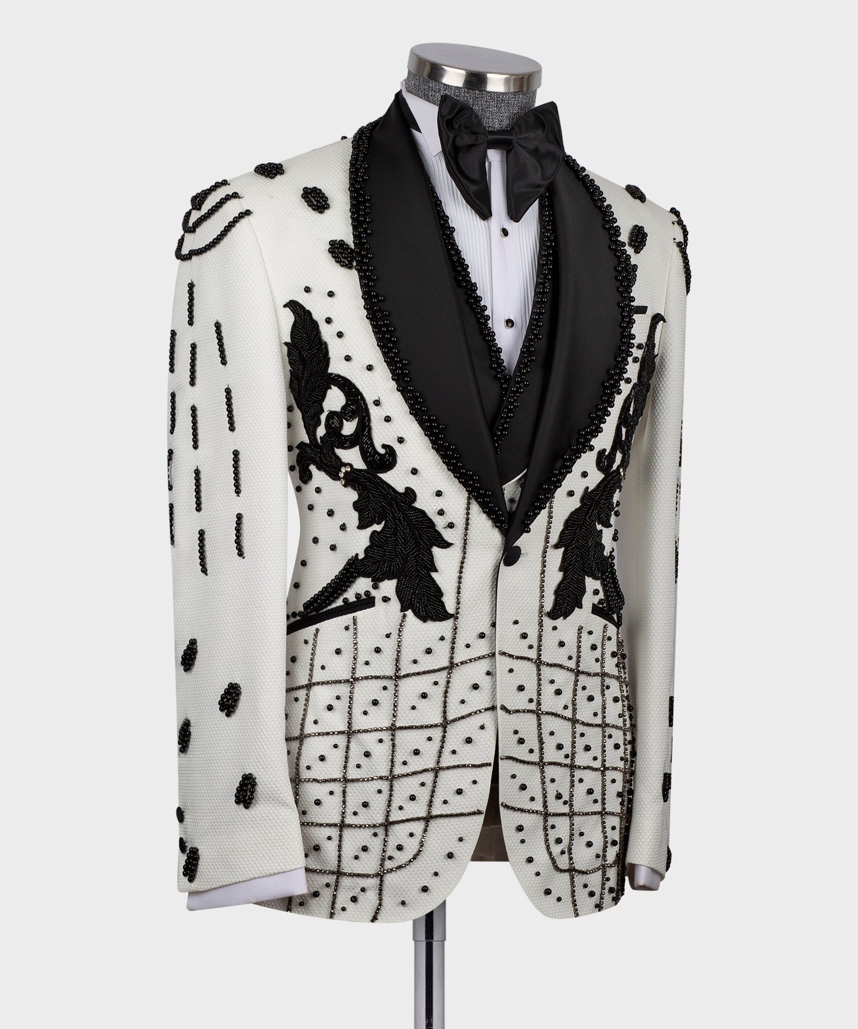 White tuxedo jacket with black floral appliqué and grid crystal embroidery