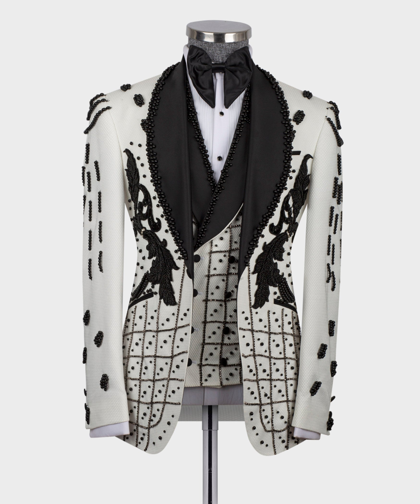 White silk tuxedo jacket with black satin lapels and crystal bead trim