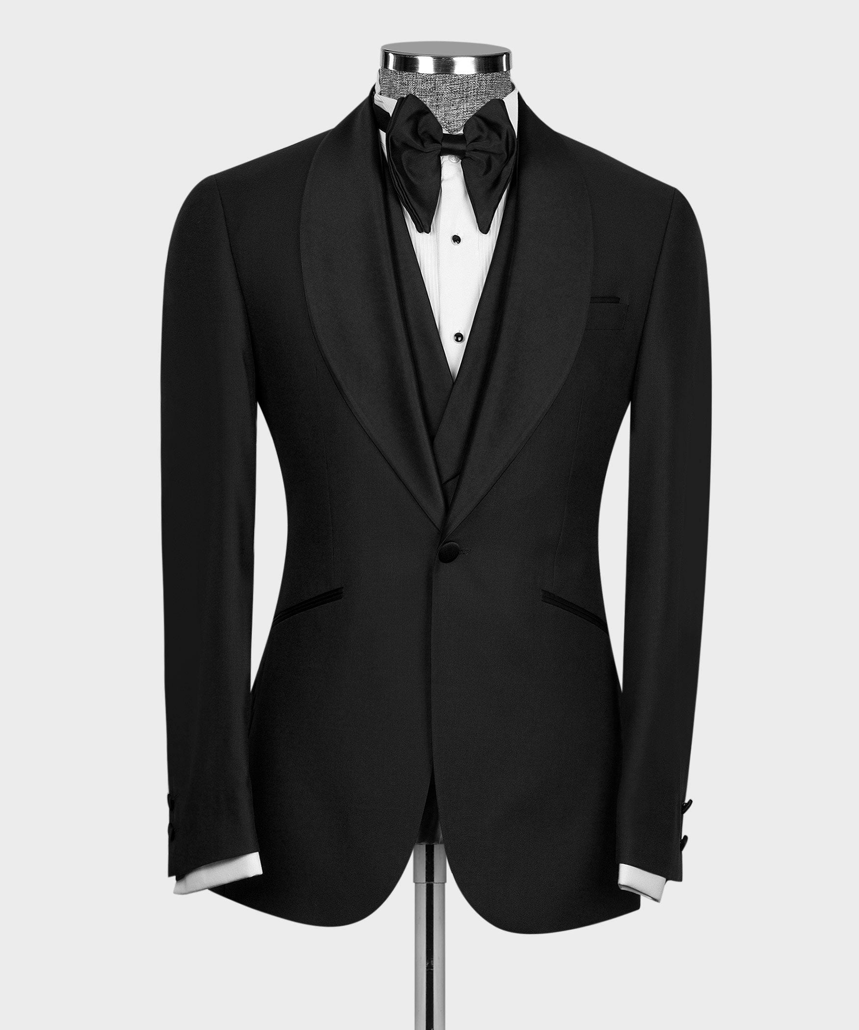 Black tuxedo jacket front with black bow tie and double-breasted vest styling