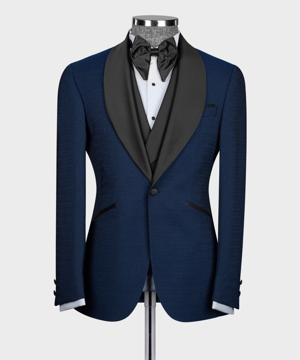 Blue tuxedo jacket, black satin lapels and vest, bow tie at neck