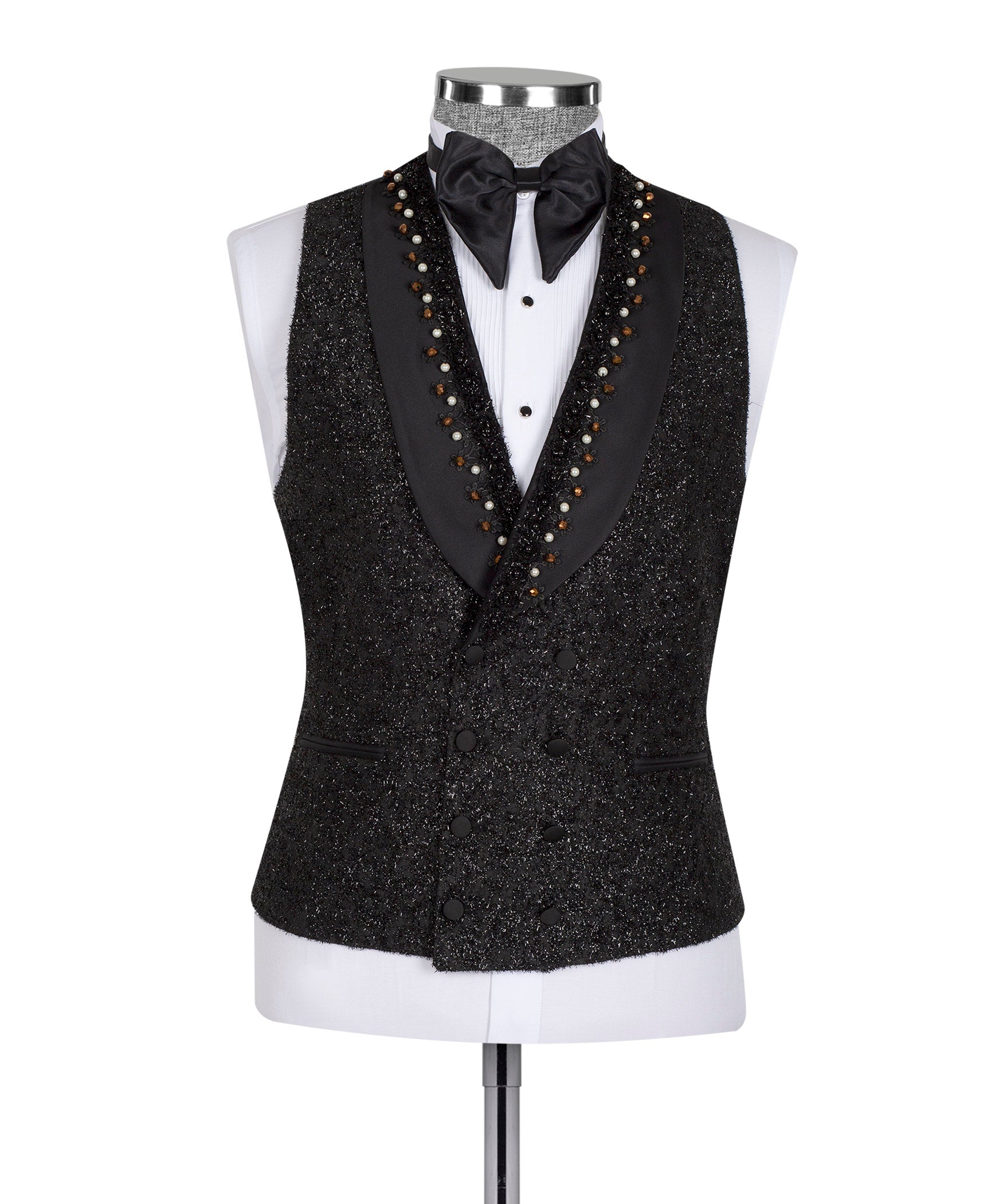 Black tuxedo vest with satin bow tie and beaded trim over white shirt on mannequin