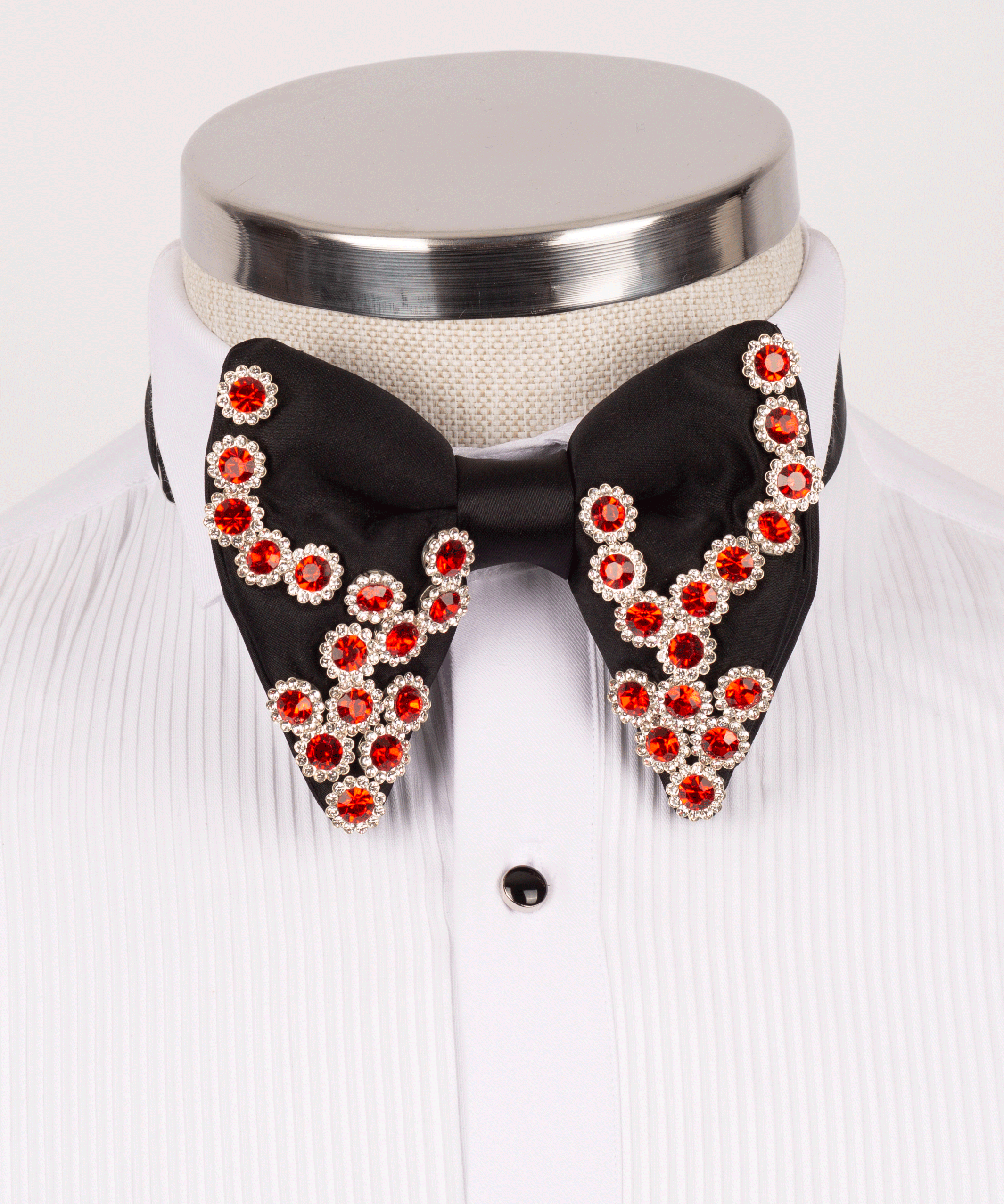Beaded bow tie with red crystal embellishments on black fabric