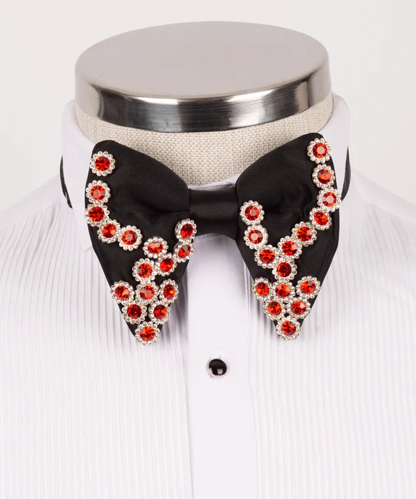 Koss Atelier black silk bow tie adorned with red crystal flower-shaped embellishments on a white pleated shirt.