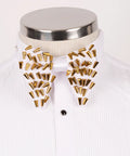 Koss Atelier white bow tie featuring scattered gold cone-shaped metal studs on a crisp white pleated tuxedo shirt.