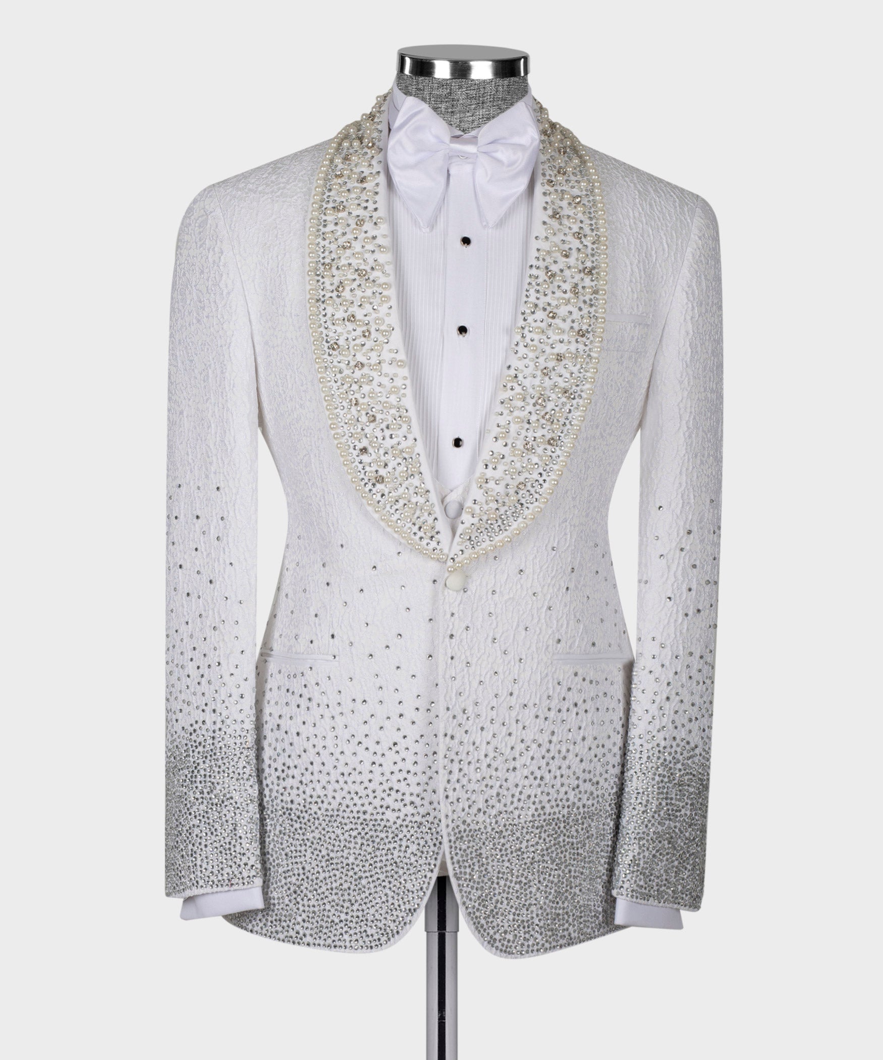 White tuxedo jacket with bow tie and gold jeweled trim on satin lapels