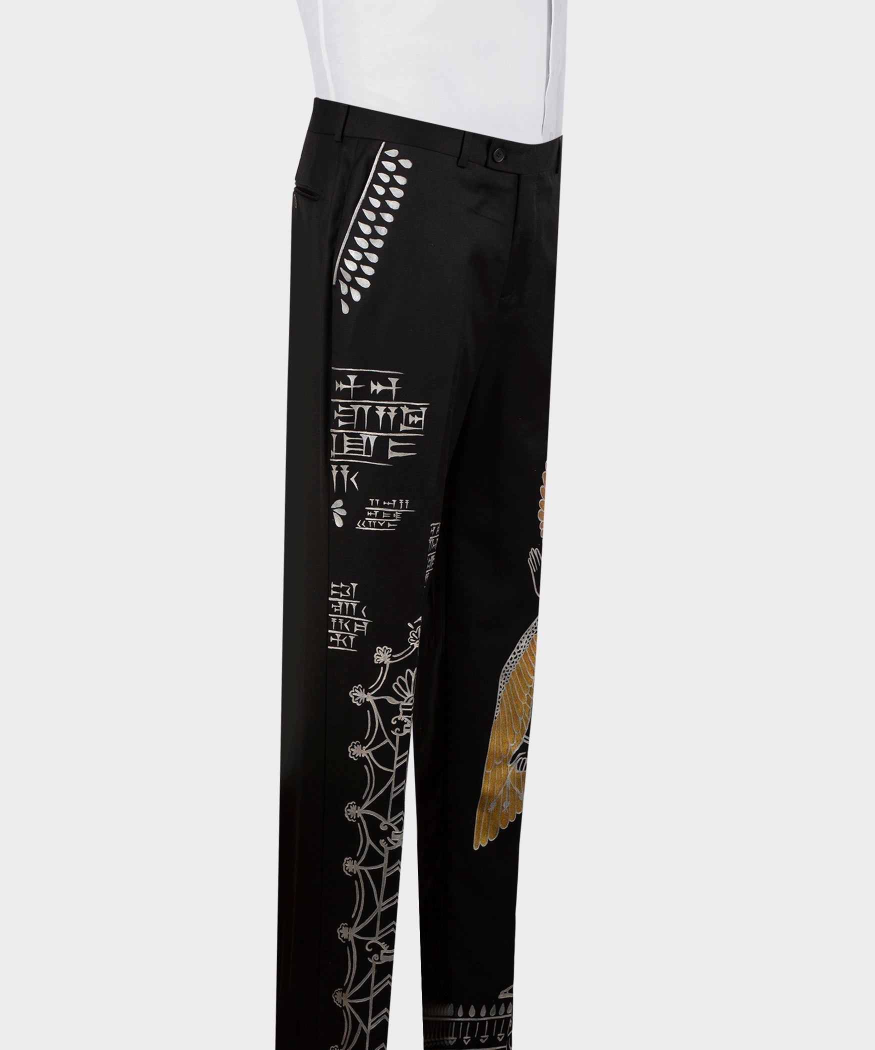 Black embroidered tuxedo trousers with white stitch designs along the side leg