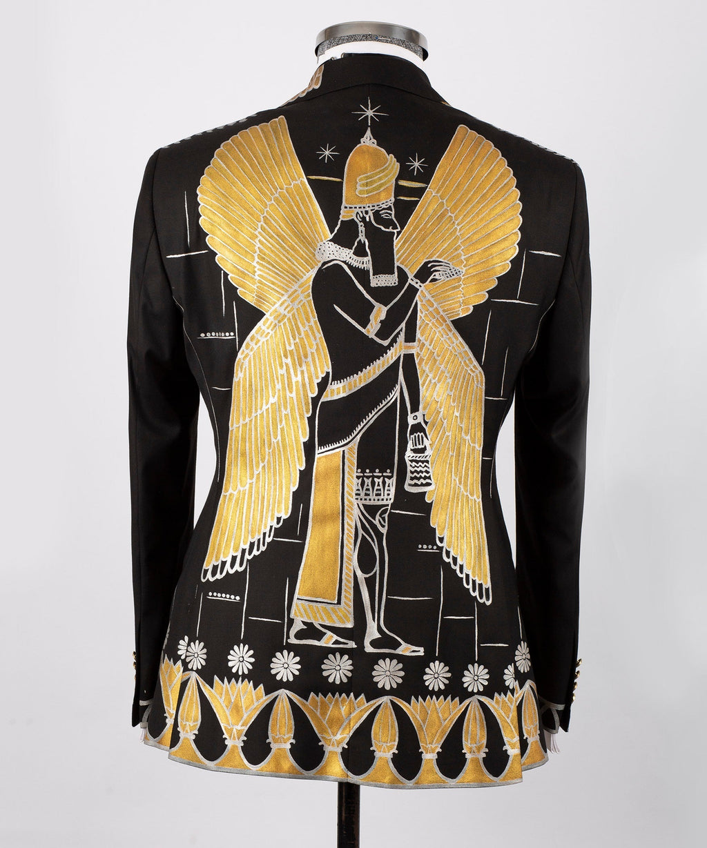 Back view black tuxedo jacket with large gold-embroidered wing motif and decorative hem