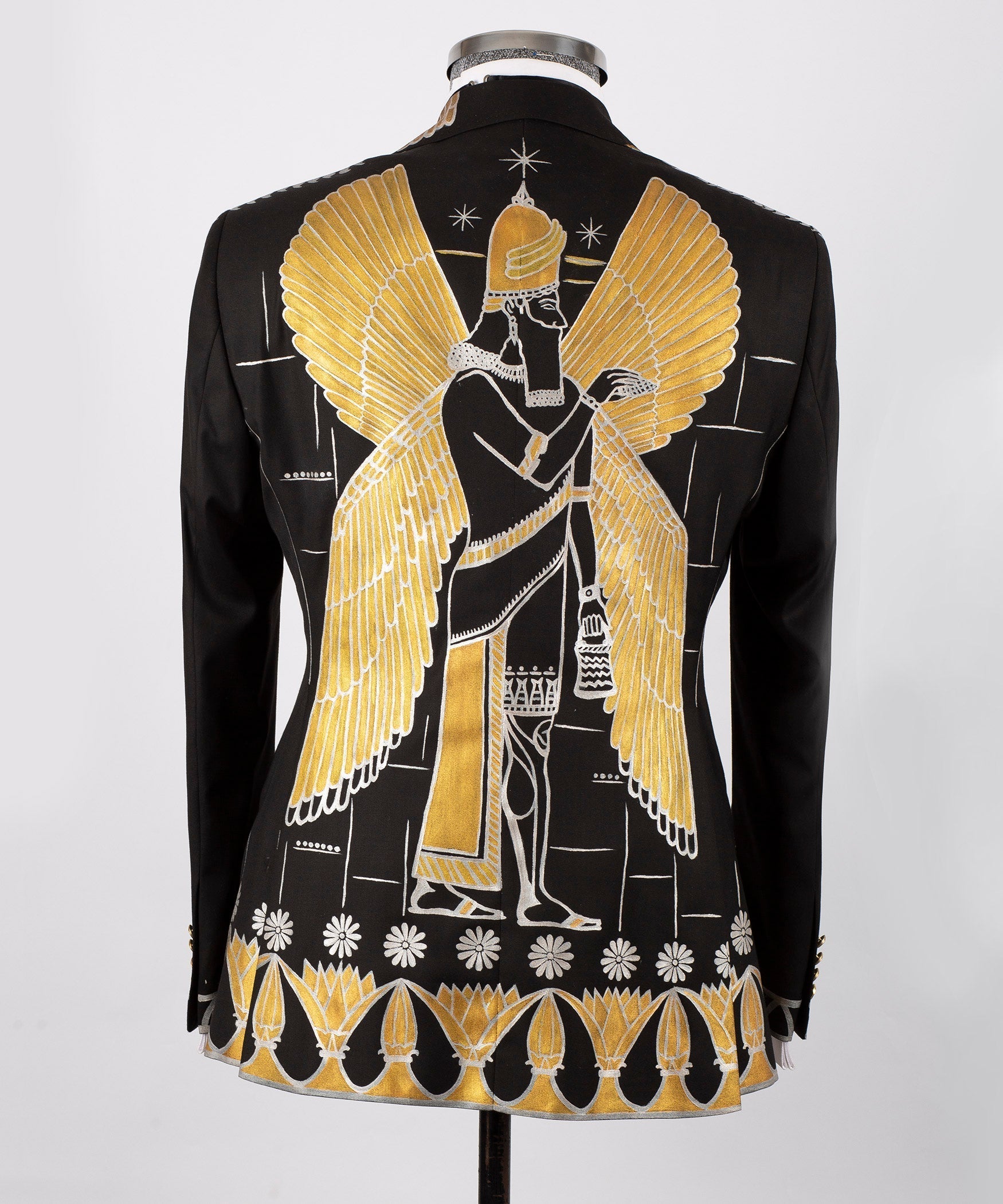 Back view black tuxedo jacket with large gold-embroidered wing motif and decorative hem