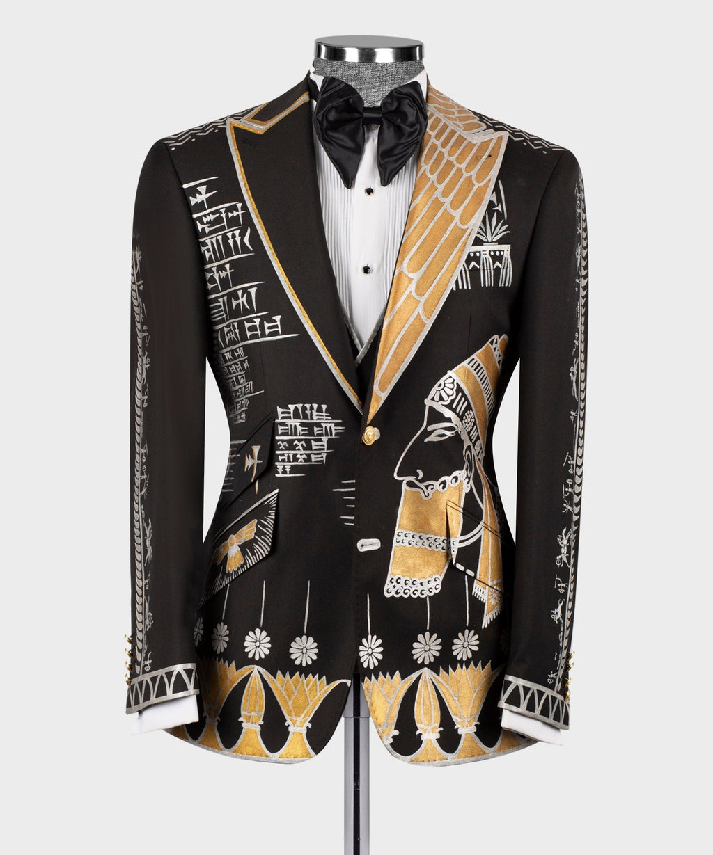 Black tuxedo jacket, white striped vest, black bow tie with gold embroidered accents