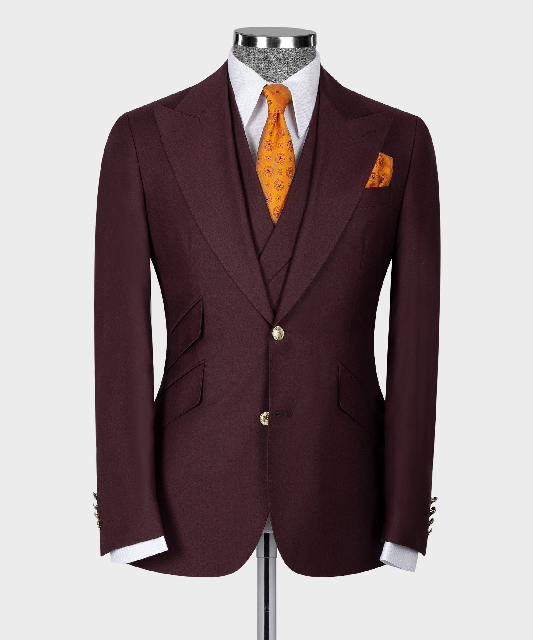 Burgundy suit jacket front with vest, white shirt and orange patterned tie